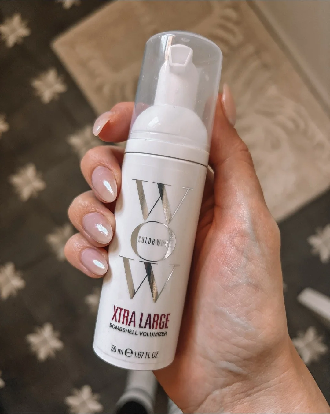 close up of color wow xtra large bombshell volumizer bottle