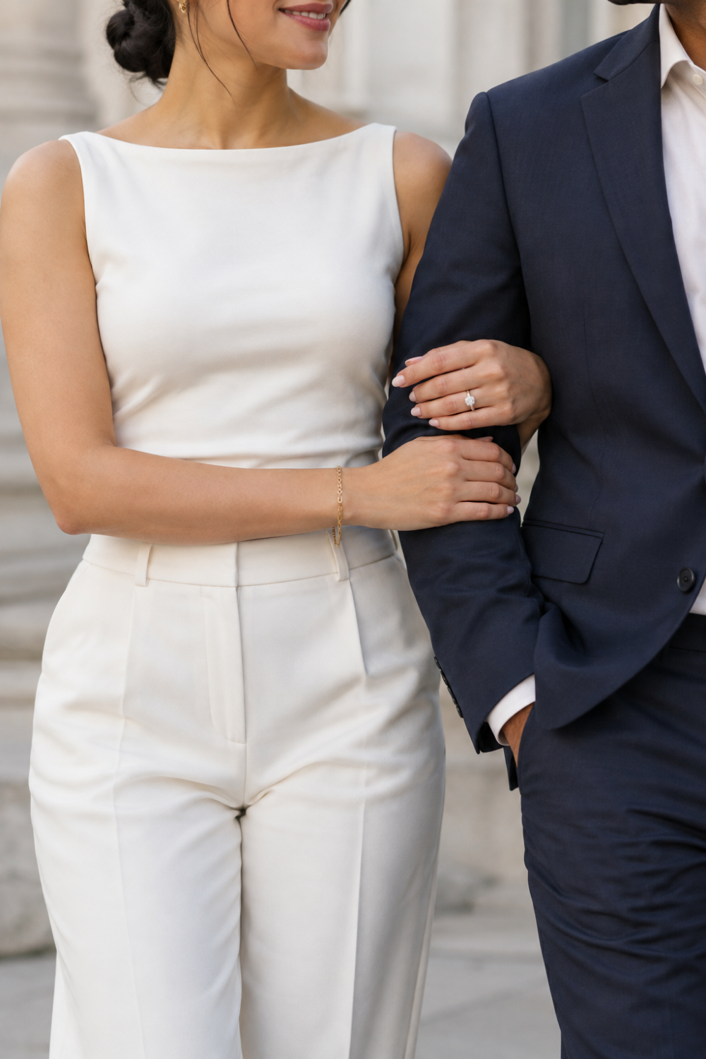 White engagement photo outfit idea featuring a white top and white trousers.