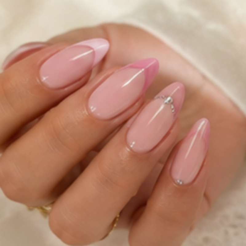 Pink manicure idea featuring soft pink french with a little bling.