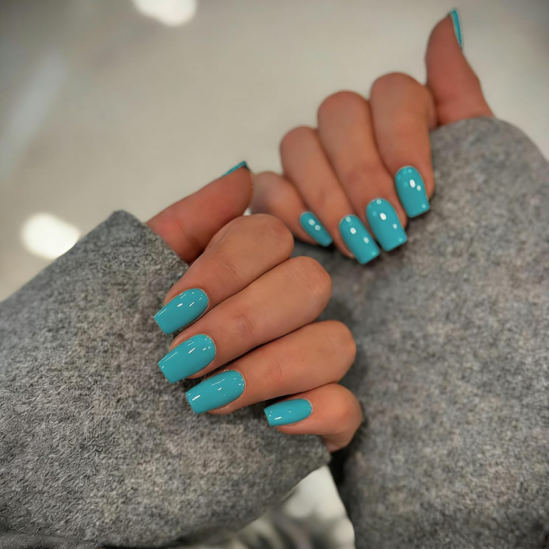 Turquoise nails that make your skin look more tan and enhance a sun-kissed glow.