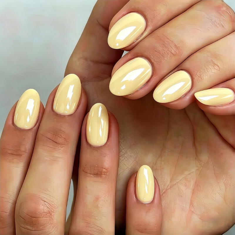 Butter yellow nails that make your skin look more tan and enhance a sun-kissed glow.