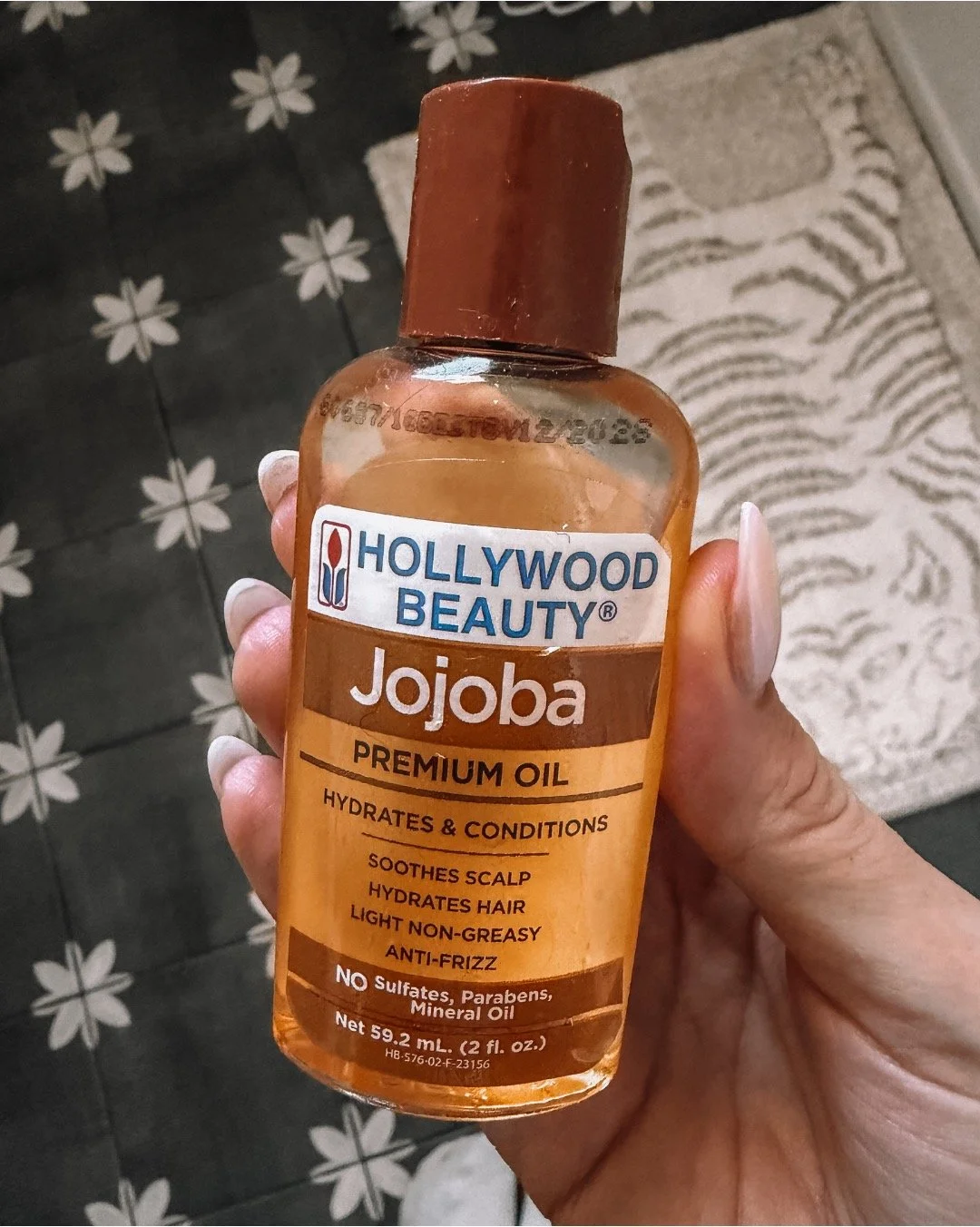 close up of hollywood beauty jojoba premium hair oil bottle