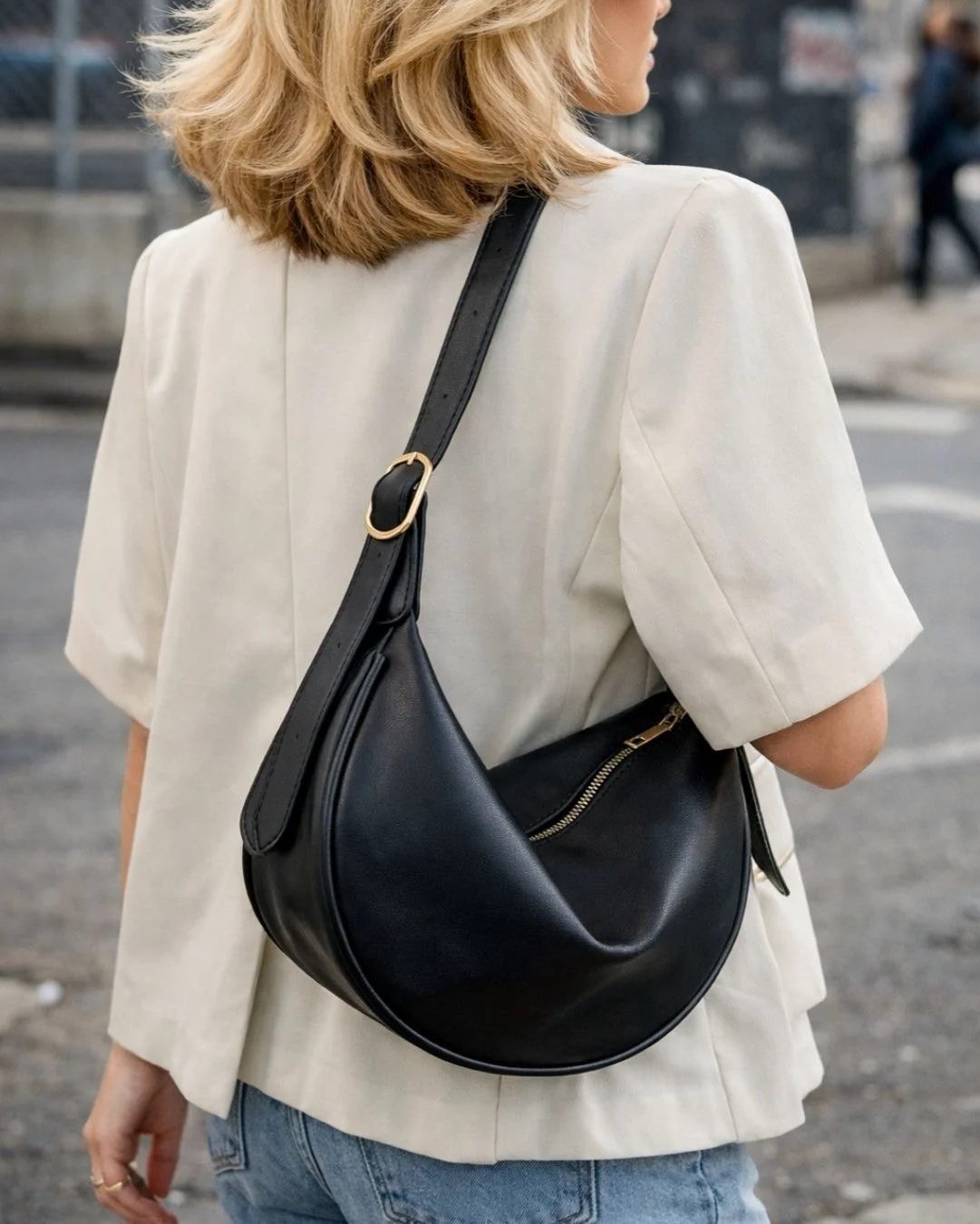 woman wearing a black shoulder bag