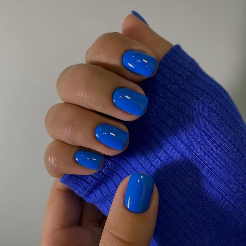 Cobalt blue nails that make your skin look more tan and enhance a sun-kissed glow.