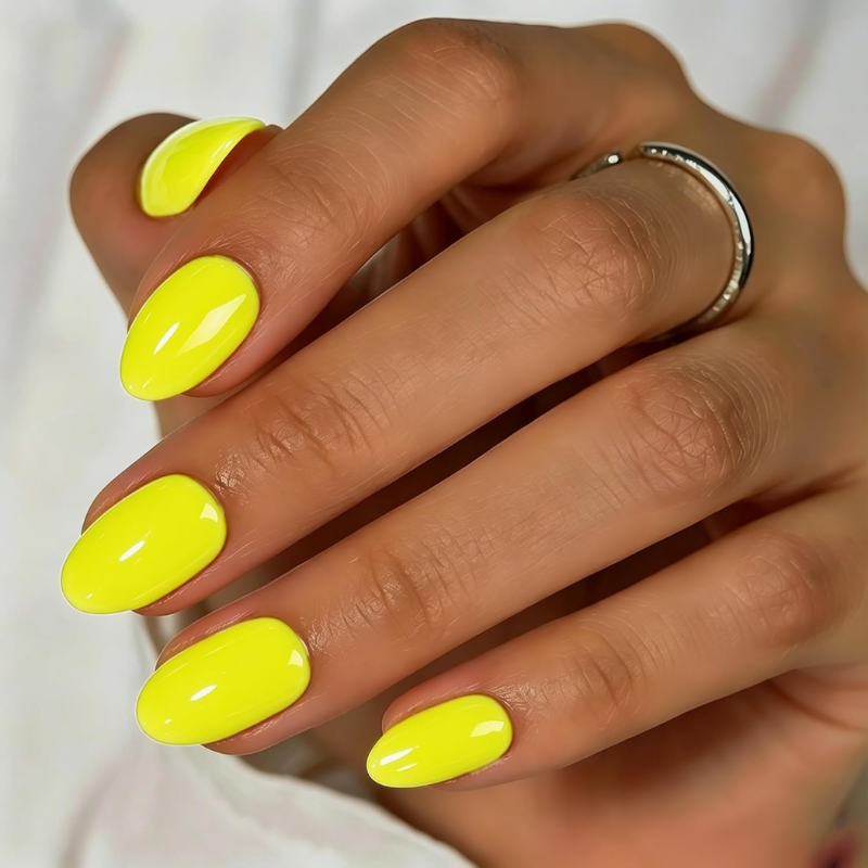 Neon yellow nails that make your skin look more tan and enhance a sun-kissed glow.