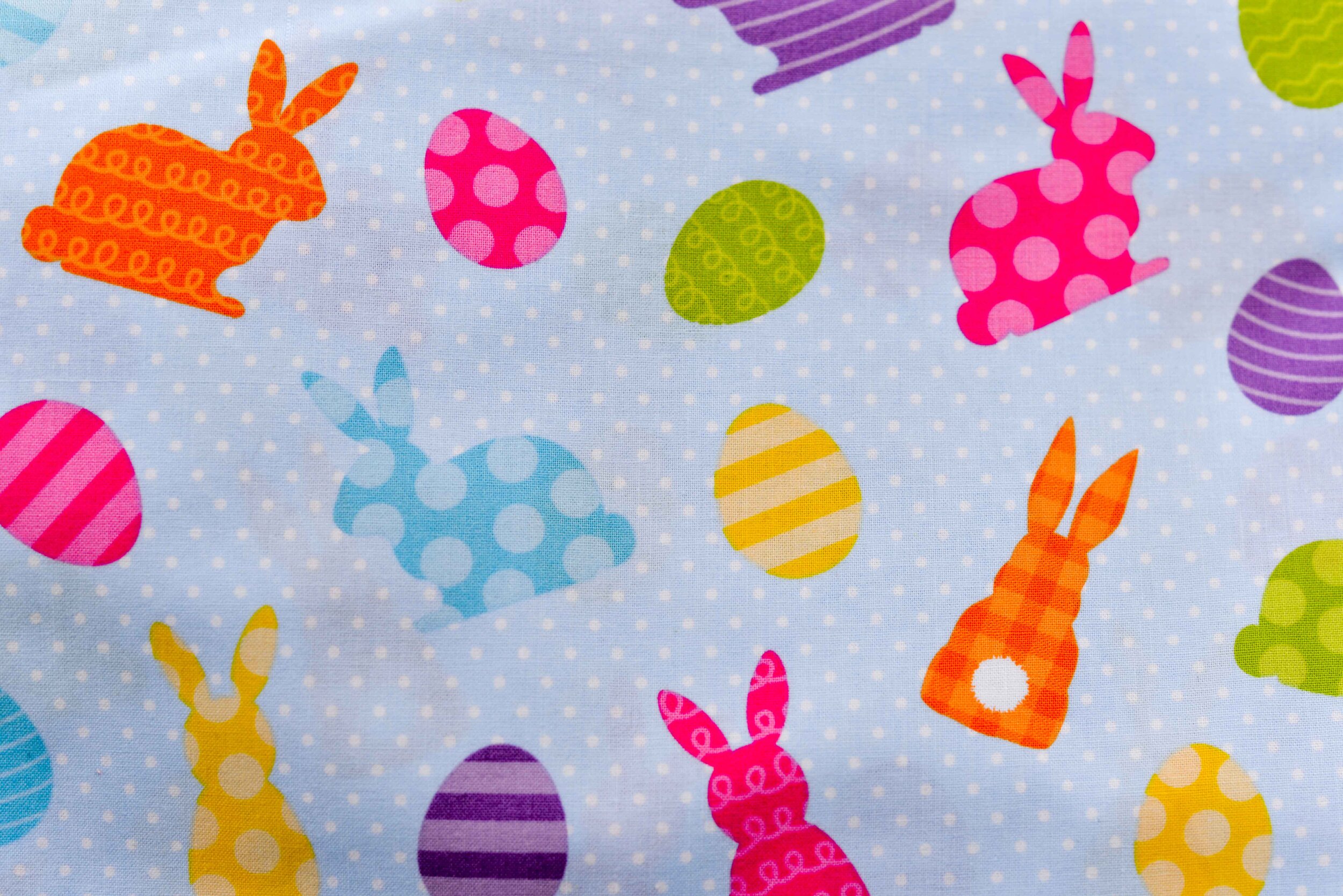 Bunny and eggs on light blue background