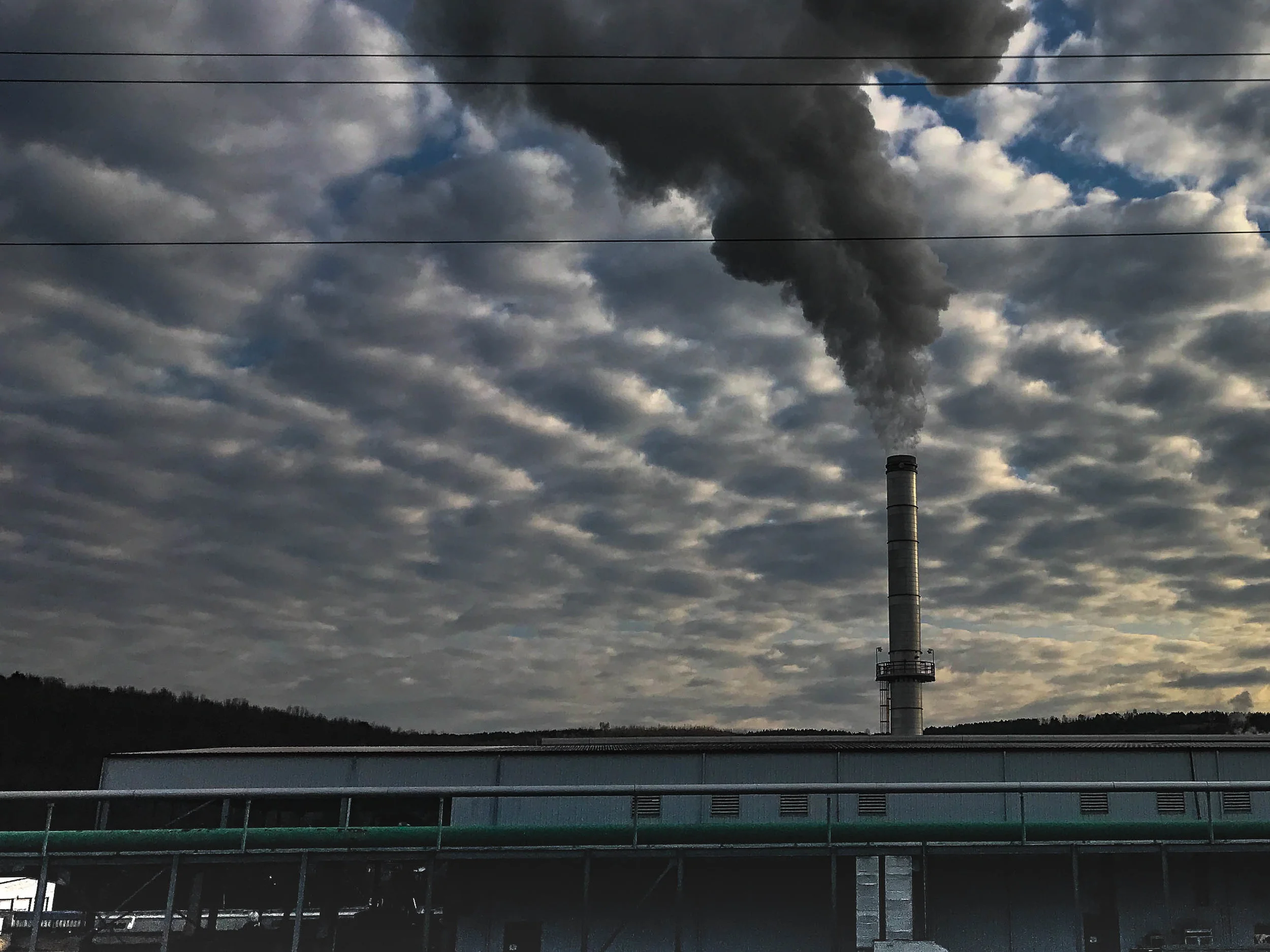 Consider how the clouds are collecting what is rising out of this mill, a long-time employer for a small town in Pennsylvania. Smoke stacks like this frequently sit in towns, or just outside of them. Next time you see one, look around at the community who gets the rain from it next.