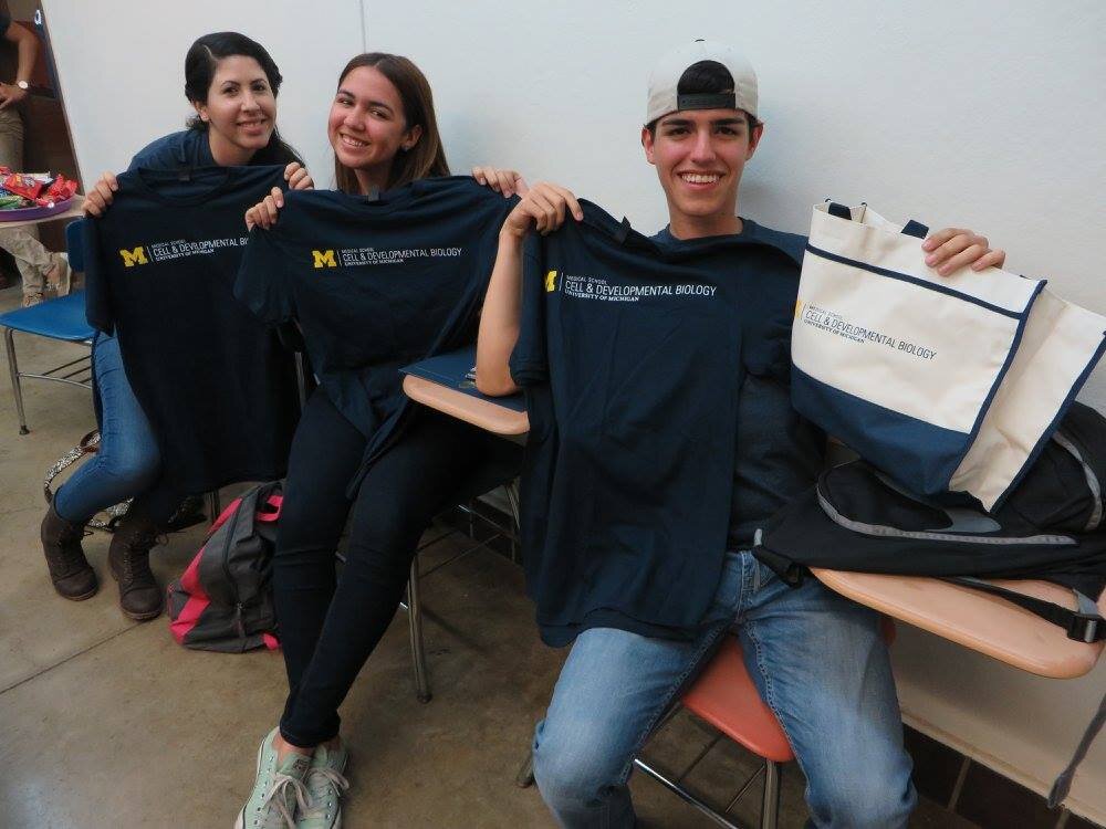  Students show off their DFB and U-M swag 