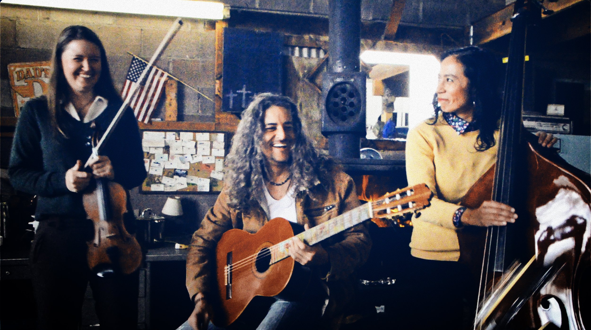 Karina Wilson (violin), Santiago Romero (guitar), and Tanya Nuñez (bass)