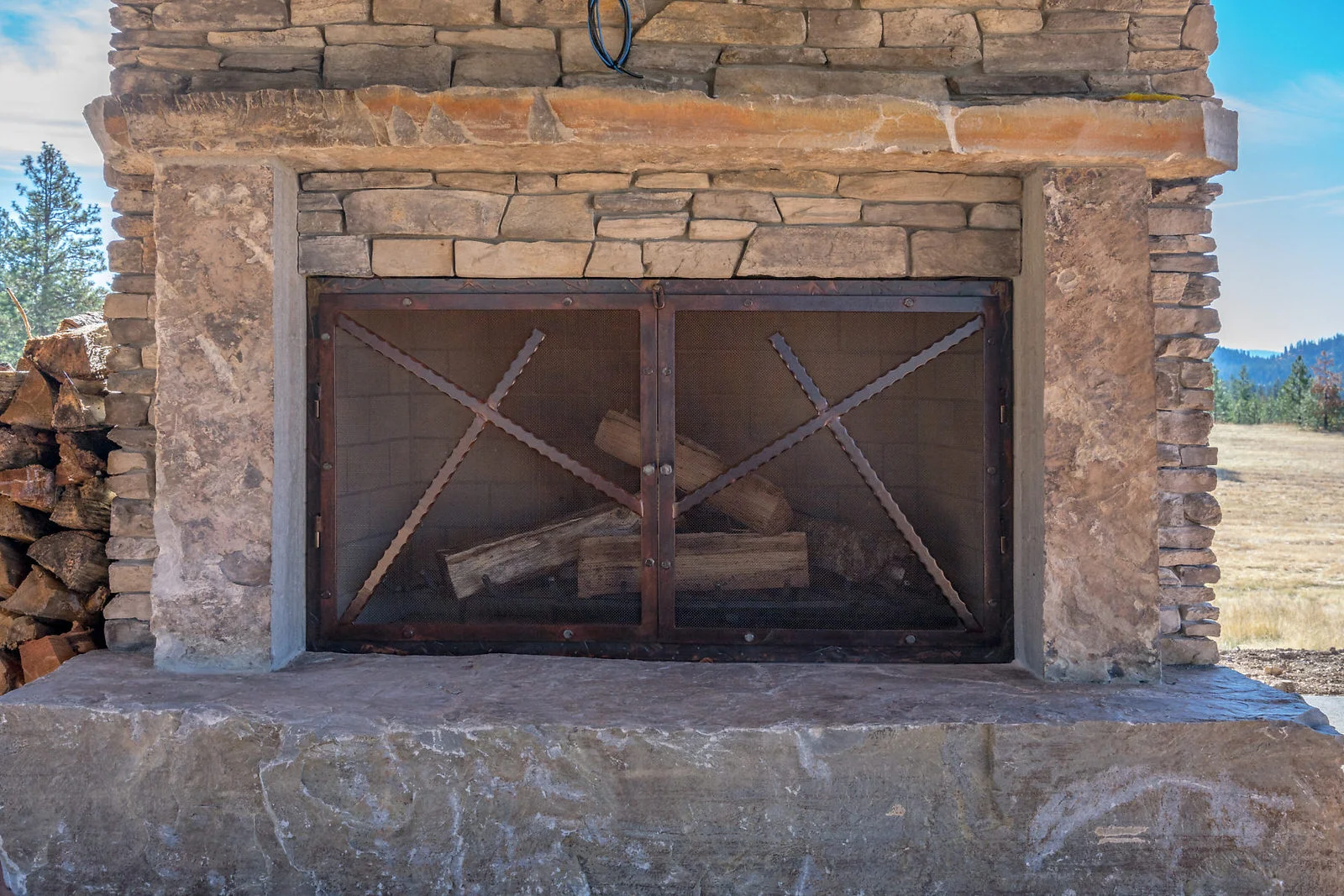 Home with Hanger Exterior Fireplace Screen Tight.jpg