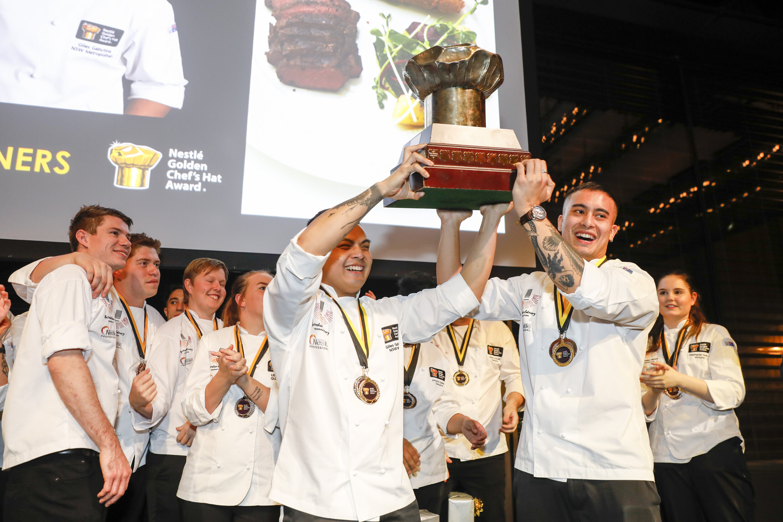 2019 Nestlé Golden Chef's Hat Award National Champions Alessio Nogarotto and Giles Gabutina With Big Hat Trophy.jpg