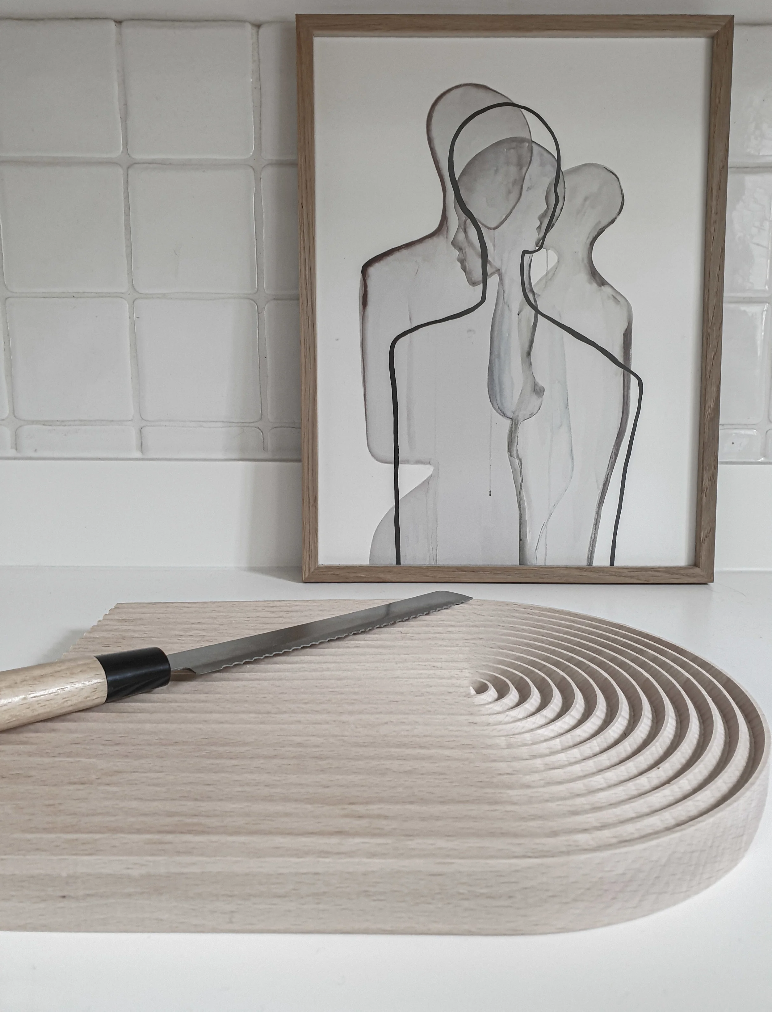Designed to reduce bread crumbs spilling on work tops this bread board by Hay combines design and function.