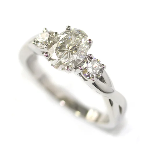 Platinum Oval and Round Brilliant Cut Diamond Trilogy Engagement Ring 2.jpg