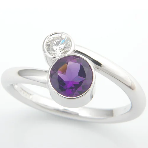 18ct White Gold Amethyst and Diamond Crossover Ring.jpg