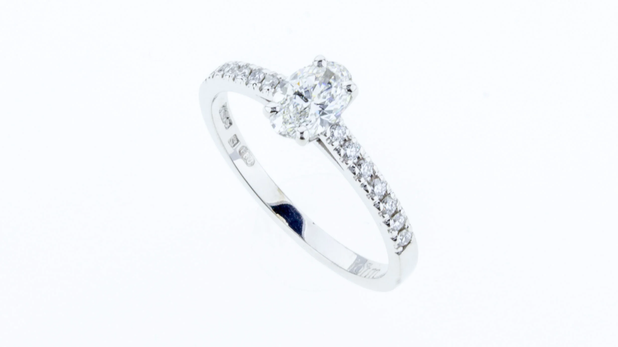 Oval Cut Diamond White Gold Engagement Ring with Diamond Set Shoulders