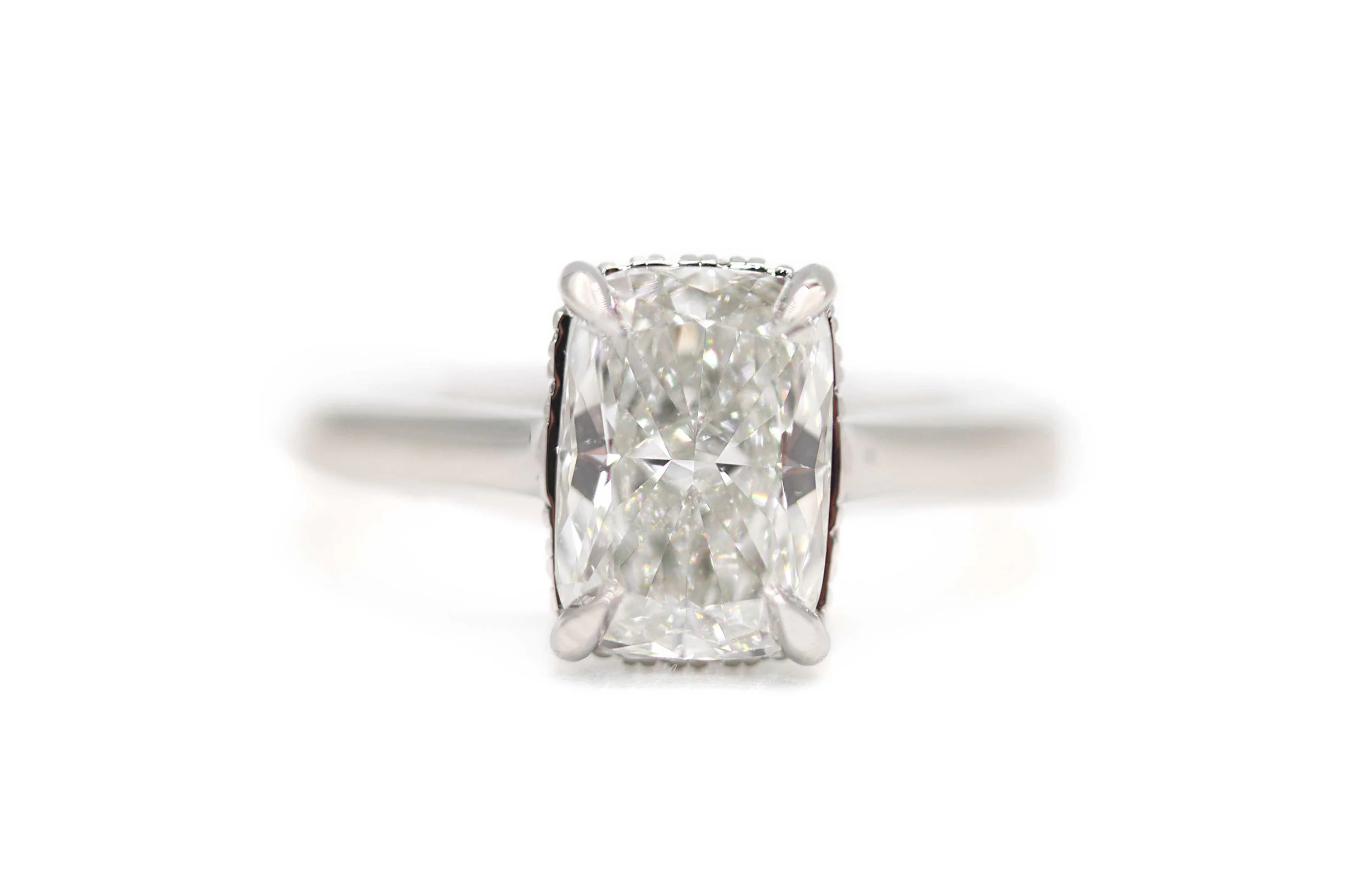 Platinum Cushion Cut Diamond Secret Halo Engagement Ring
