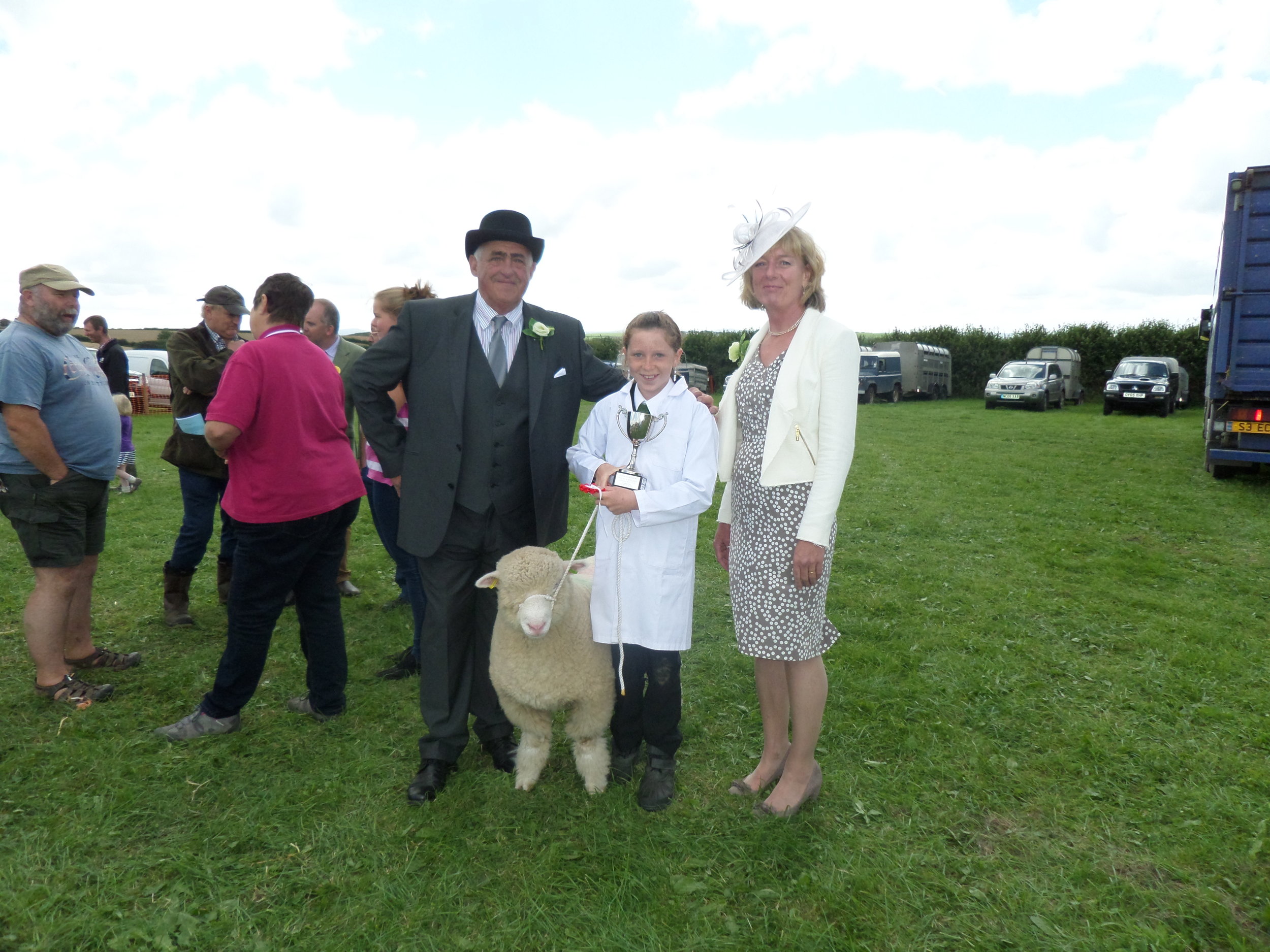 Holly Pennells, winner of Mr and Mrs G King cup for Young Handlers with President John Bone and his wife Helen