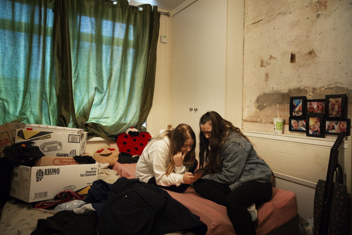   Kayleigh in her bedroom with Millie.      “And then she comes back with lots of apologies and all the teachers are happy, and two days later it all happens again…”  