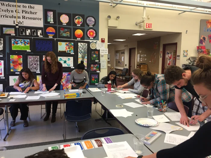 Professor Usmachi-Bers and students working