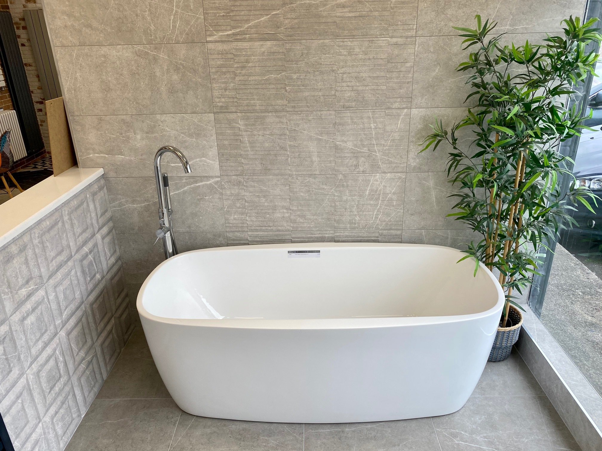Riva-Tiles-Bathrooms-Cork-showroom-bath-designer-round.jpg