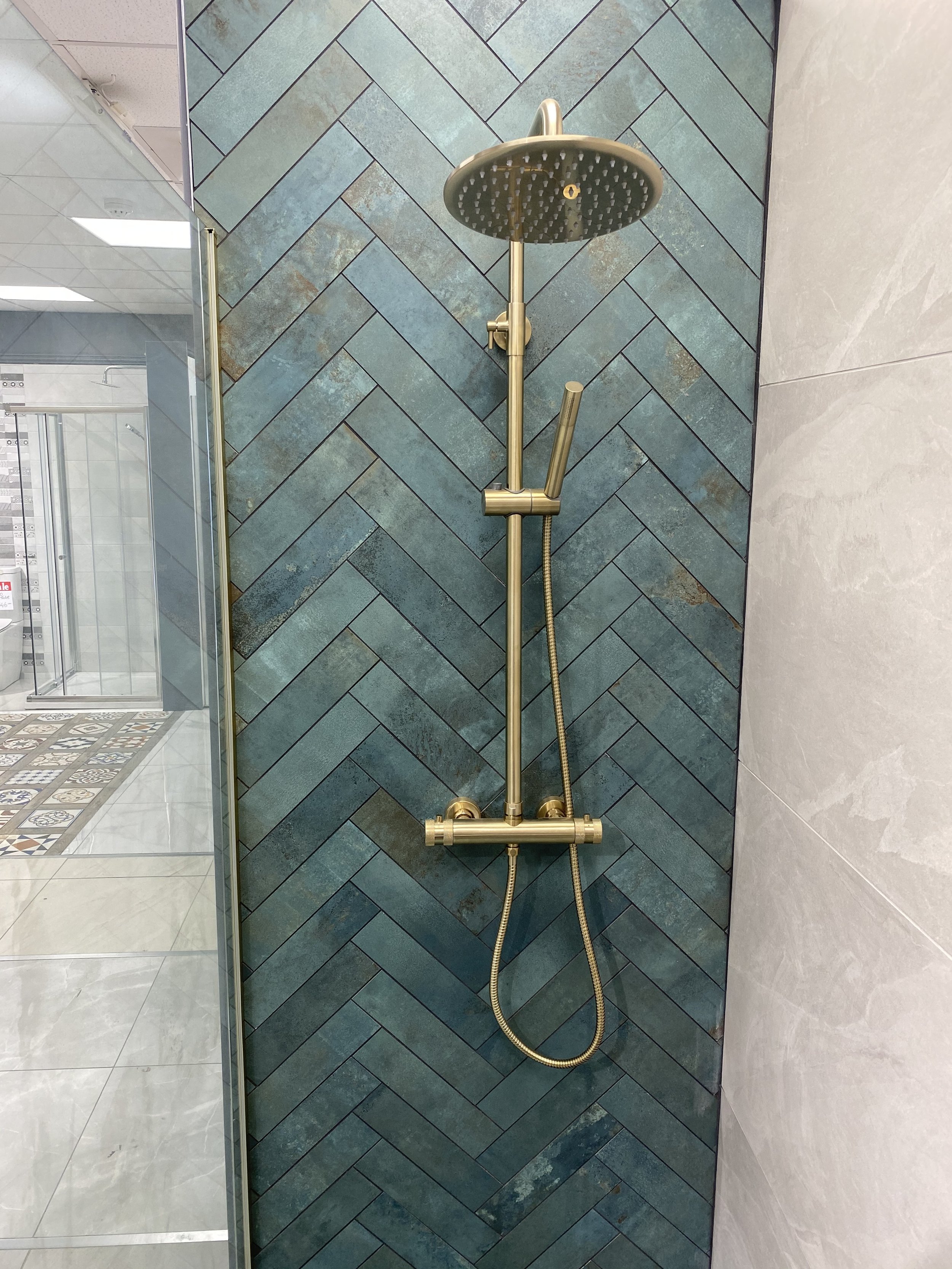 Riva-Tiles-Bathrooms-Cork-showroom-gold-shower-head.jpg