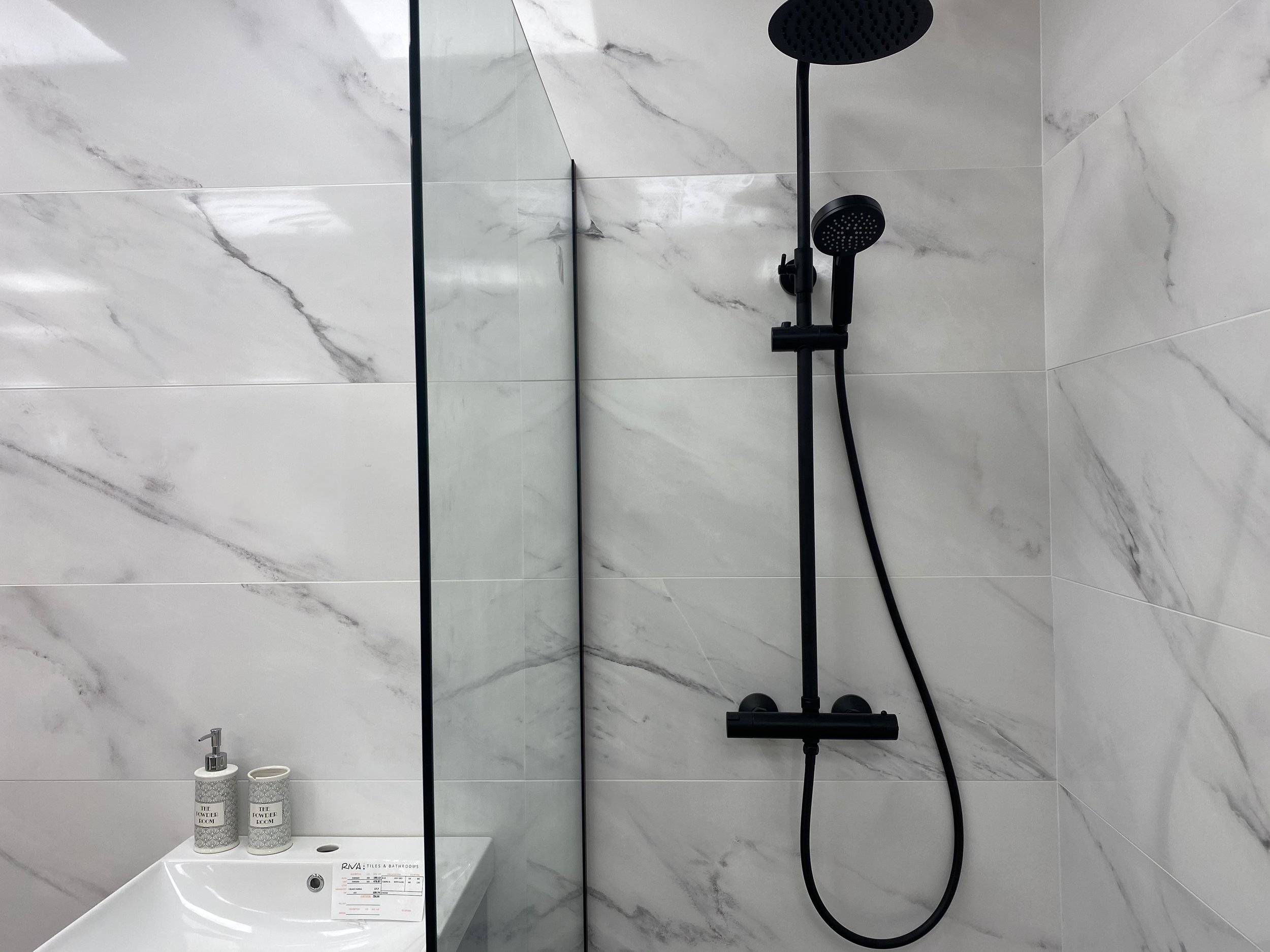 Riva-Tiles-Bathrooms-Cork-showroom-black-shower-head.jpg