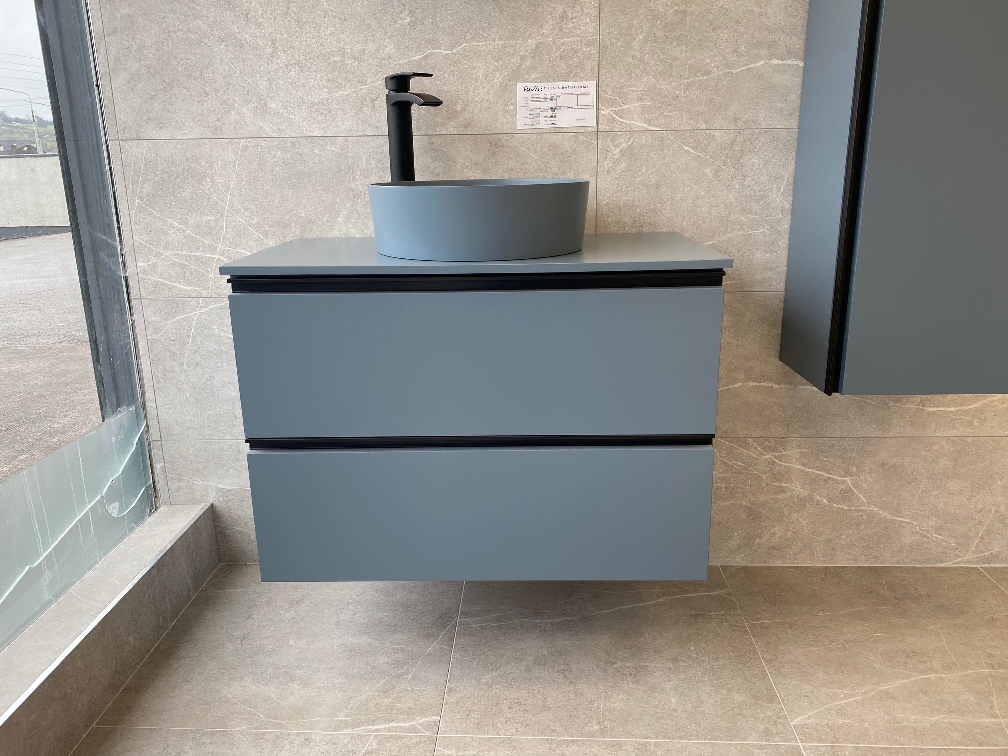 Riva-Tiles-Bathrooms-Cork-showroom-blue-grey-cabinets.jpg