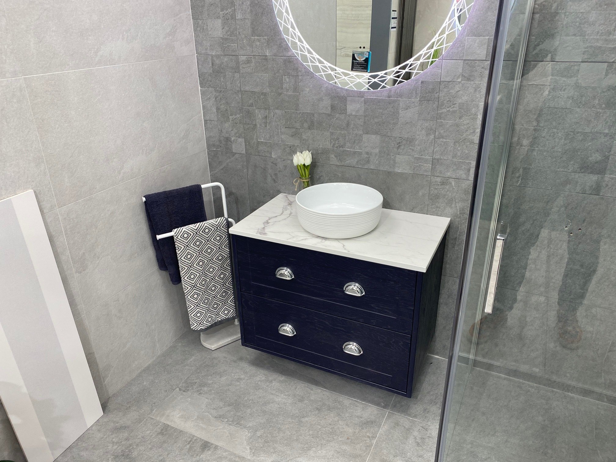 Riva-Tiles-Bathrooms-Cork-showroom-navy-units.jpg