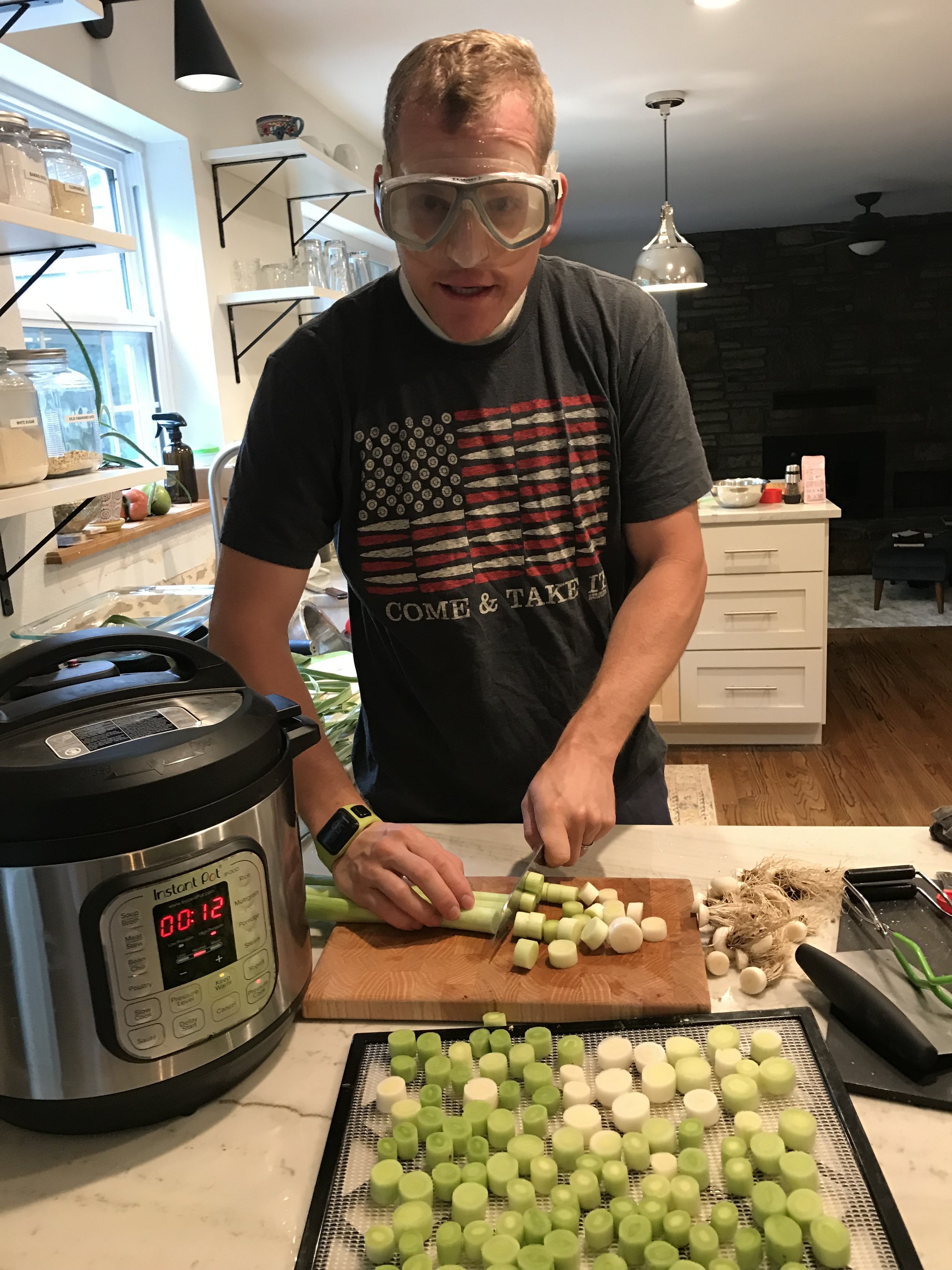  I hope Cameron doesn’t see this picture- he might want me to take it off the blog! Haha! He was helping cut leeks for the dehydrator and man they sting your eyes so much when they are fresh. Swim goggles do the trick to keep the tears at bay! 