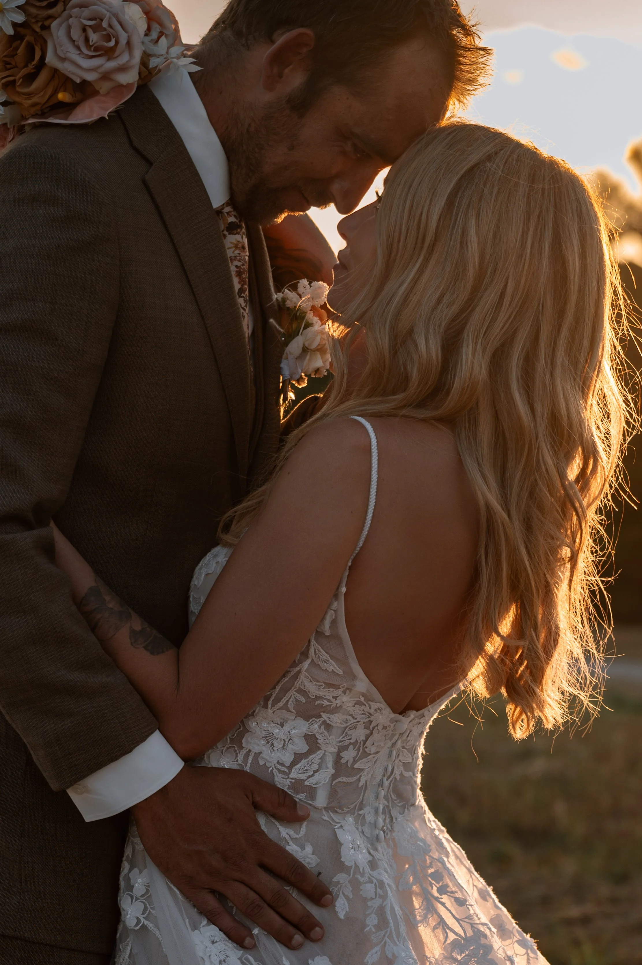 A soulful portrait of a bride and groom having a quiet moment together during golden hour in Ontario.