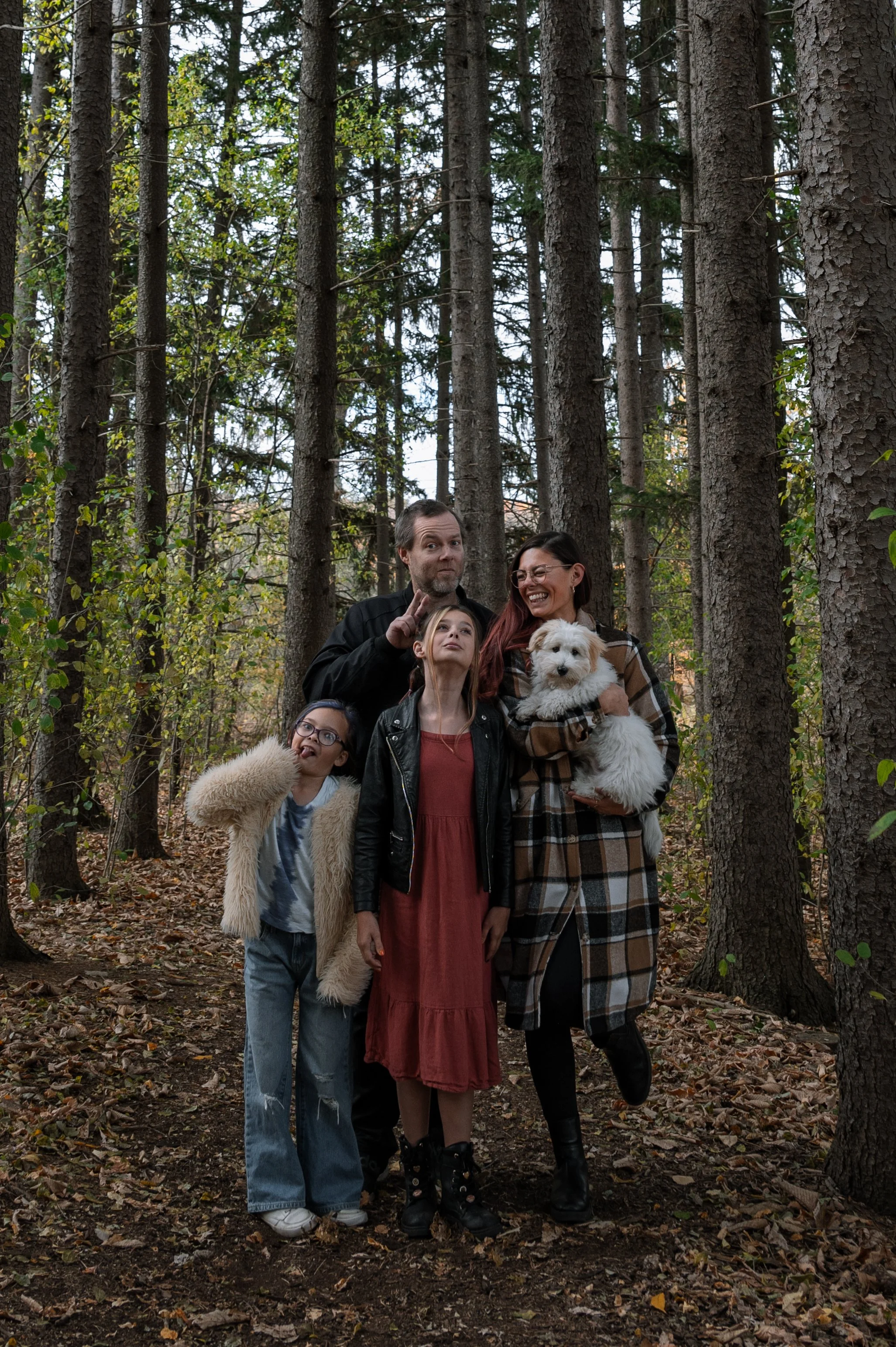 Toronto family photographer Mia Purdy and her family making silly faces together in Aurora, Ontario.