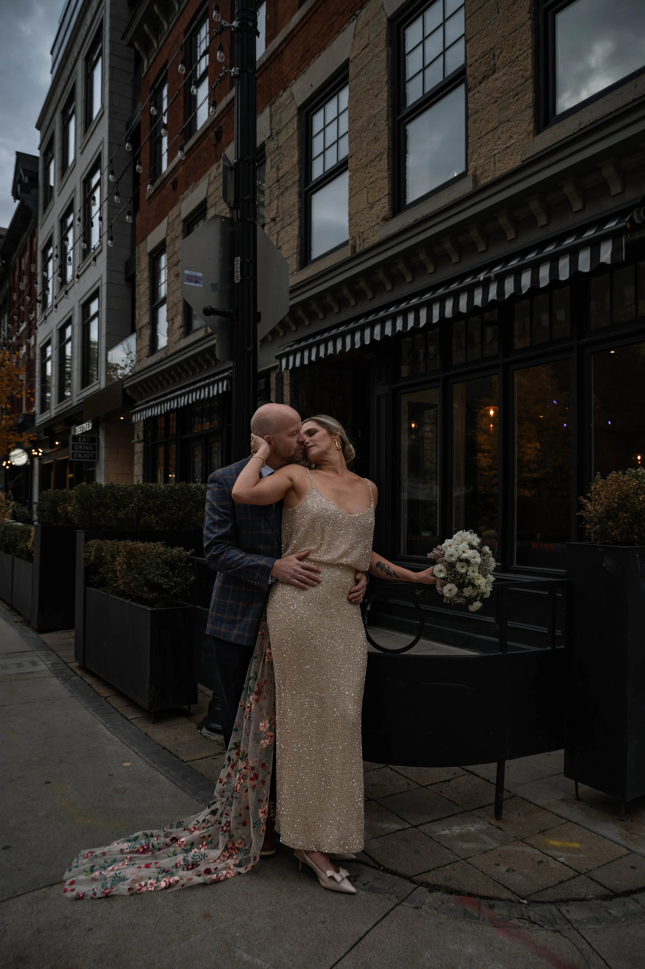 Documentary wedding photography in Hamilton, Ontario: an editorial image of the bride and groom embracing, completely in their own world.