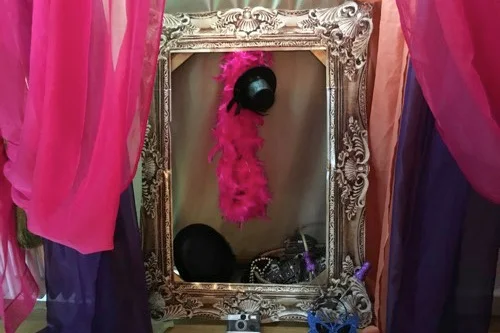 Photo booth – you have use of our large picture frame, brightly coloured drapes forming a back drop, LOADS of props and pictures frames for you to take your own pictures.