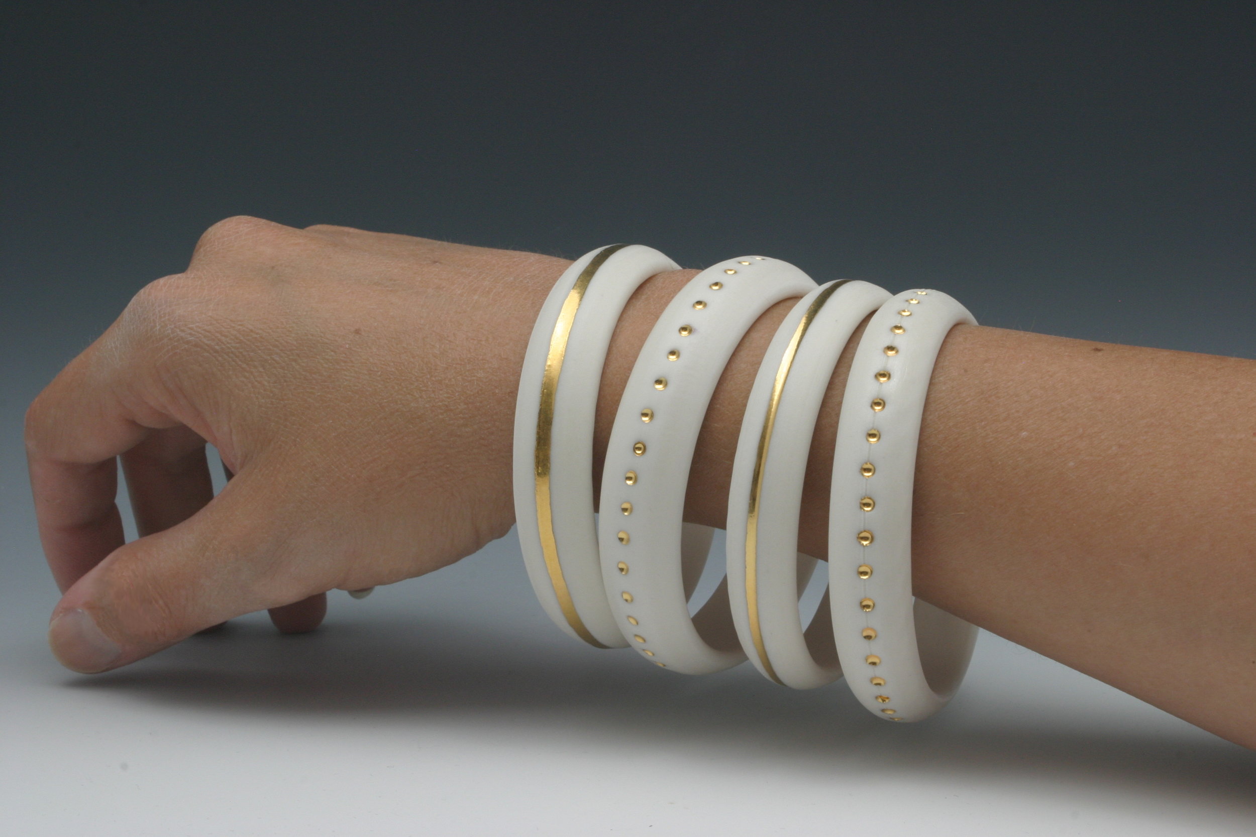 Heidi Kunkel porcelain wheel thrown bangles with gold Seattle handmade pottery Heidi's Pottery