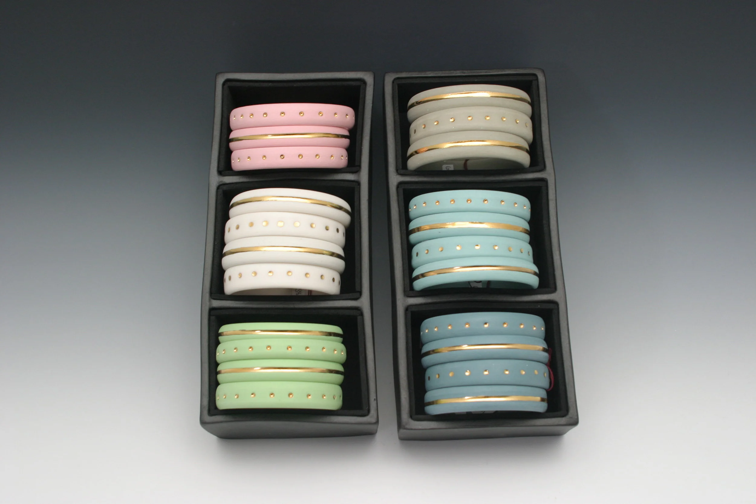 Heidi Kunkel porcelain wheel thrown bangles with gold Seattle handmade pottery Heidi's Pottery