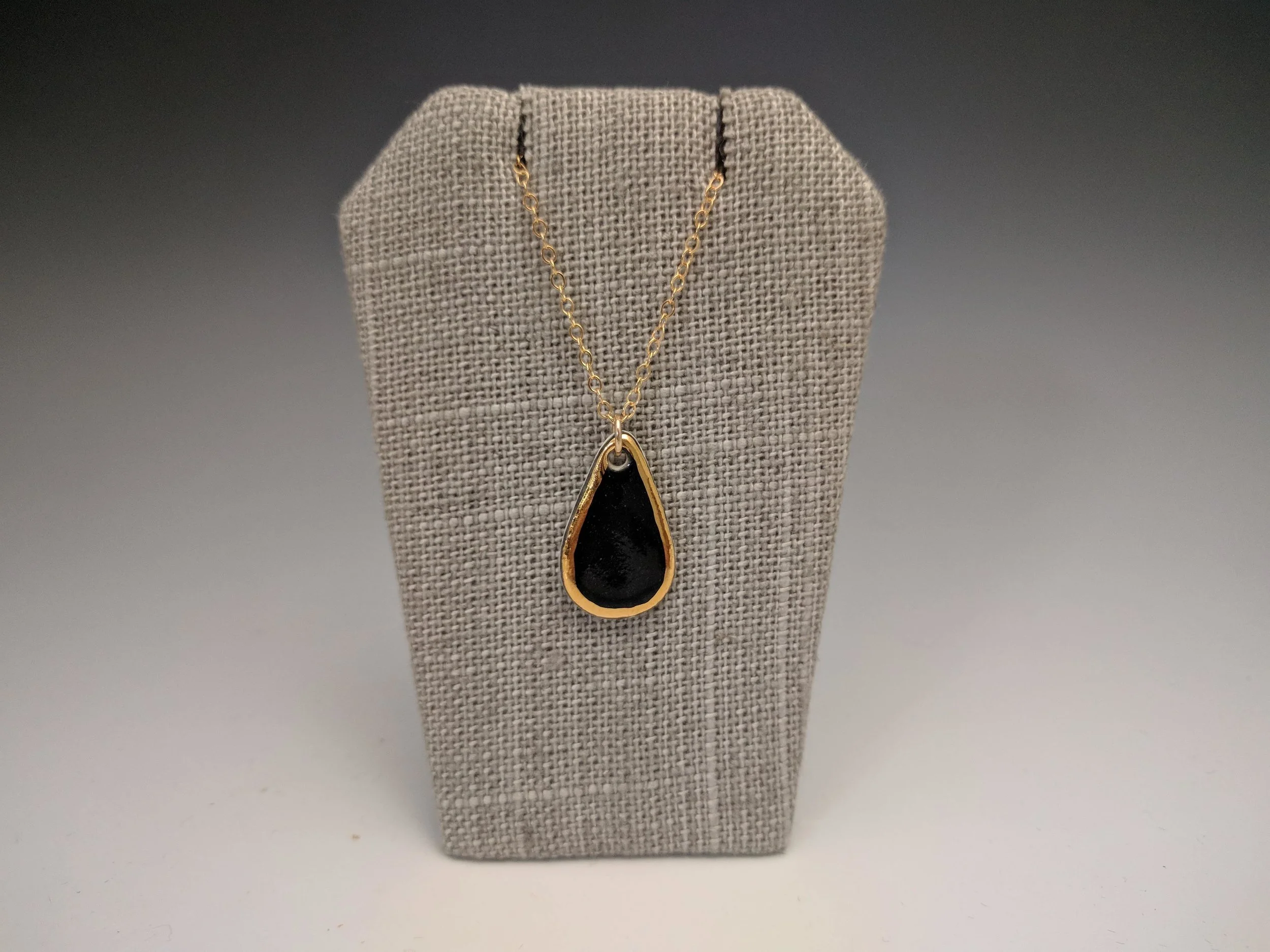 pendant - teardrop in black with gold.jpg