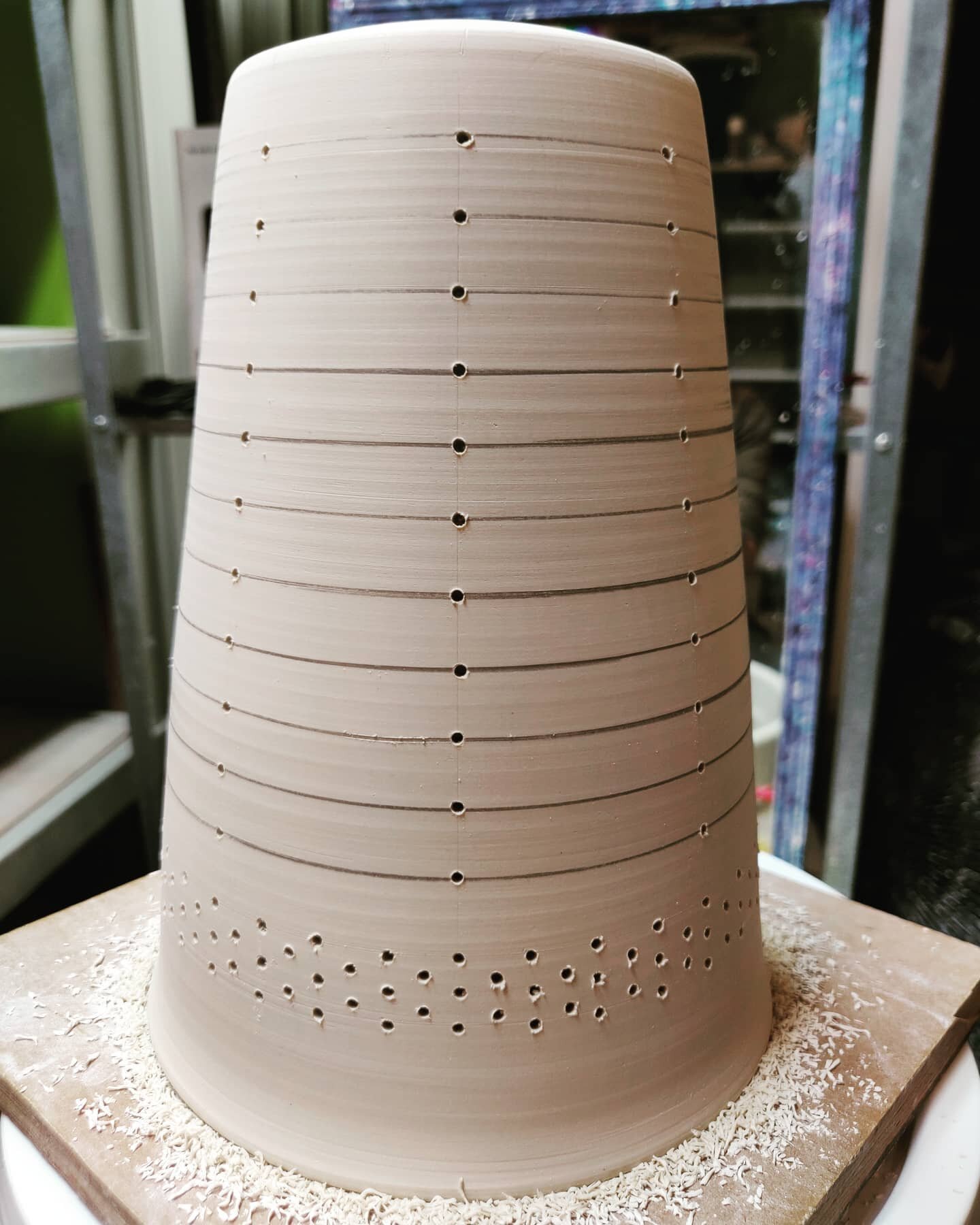 Working on the next in the pendant lamp series - lots of holes (248 to be exact) freshly drilled into this one. Next step is to smooth the edges of each of the holes (inside and out) and to sponge all the measurement lines away.
