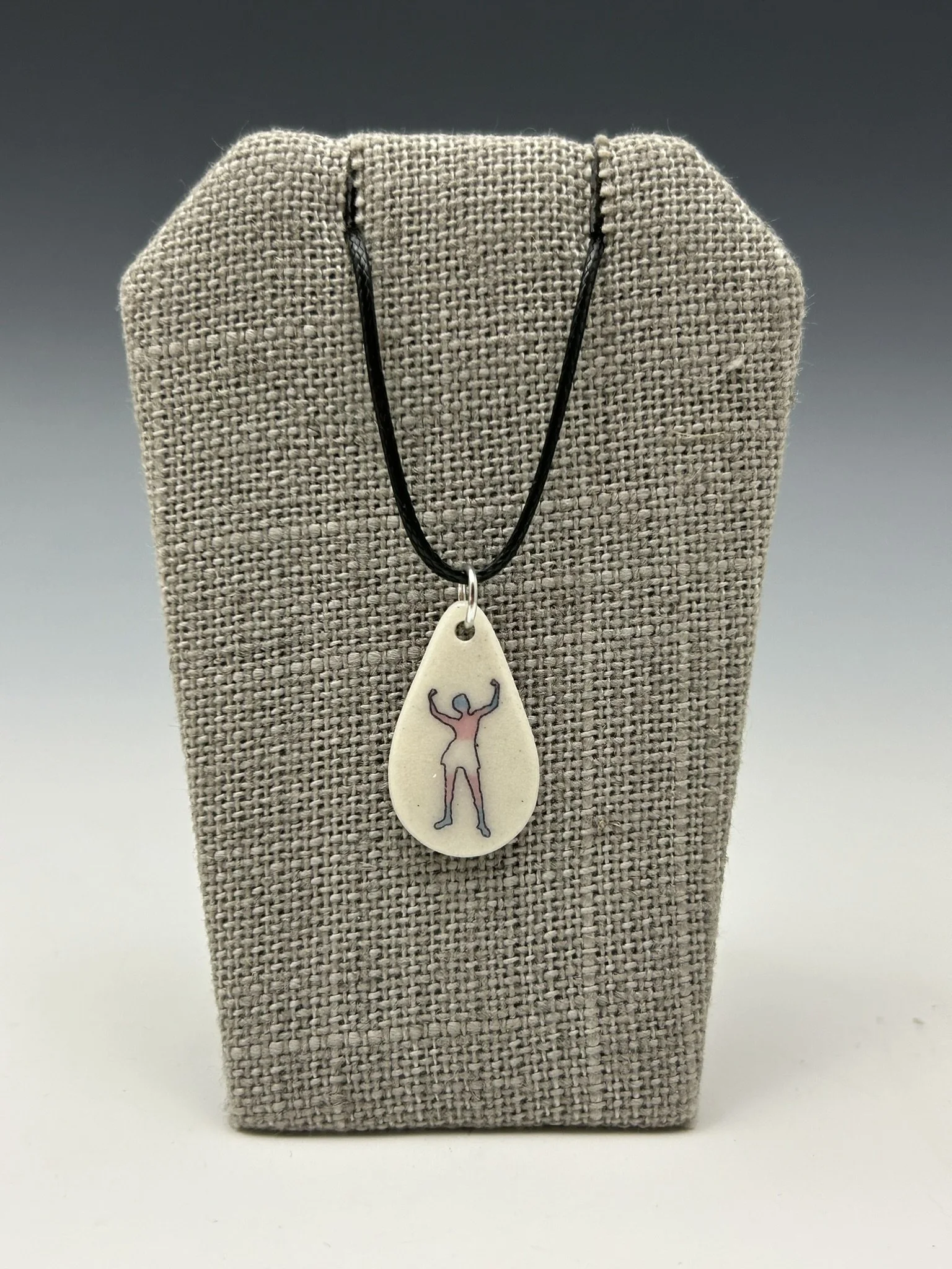 pendant - teardrop trans pride on cord.JPEG