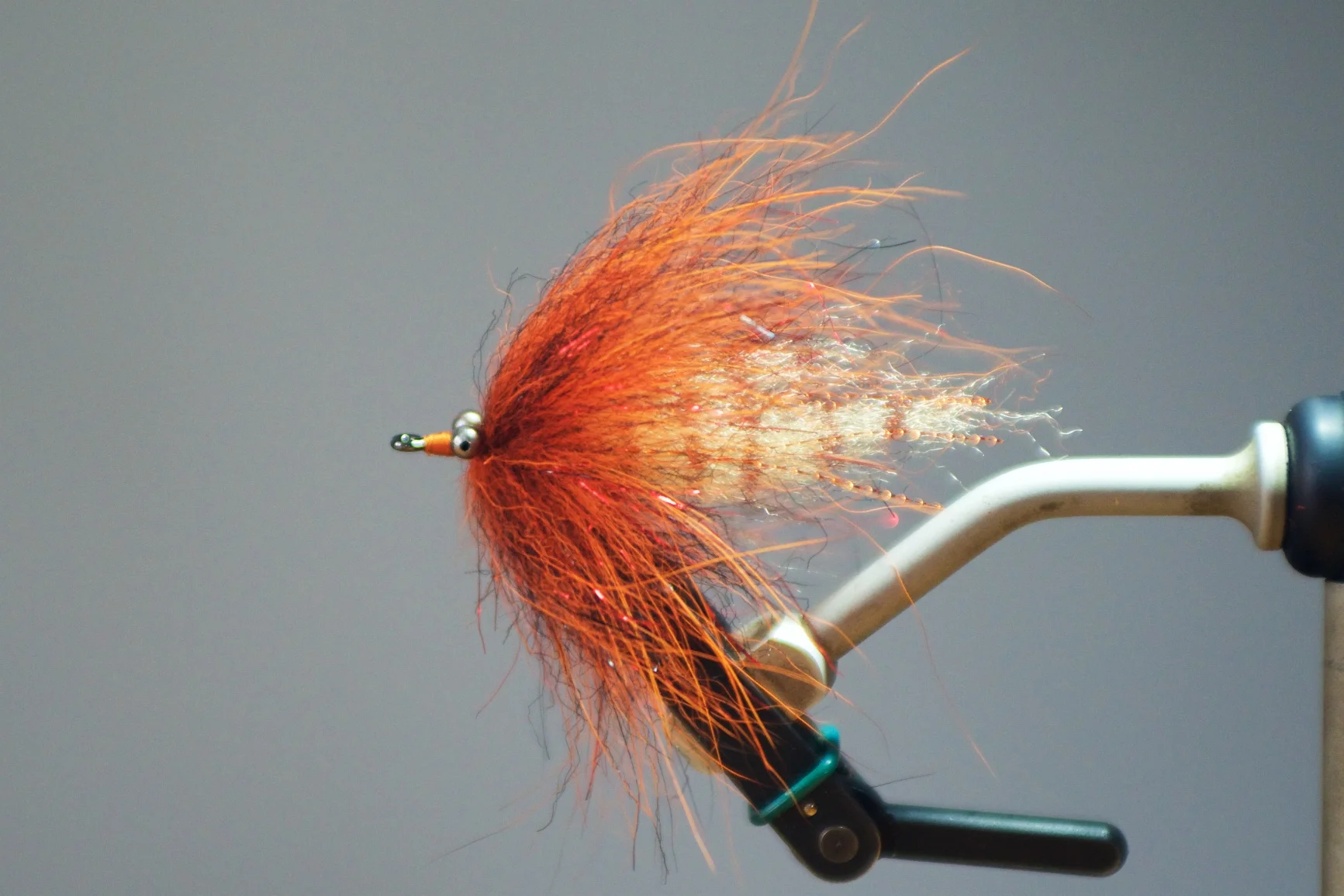 Step 6: Palmer your EP Brush up the shank to a point just behind the eyes and tie off. Taper your thread just in front of the eyes and whip finish.