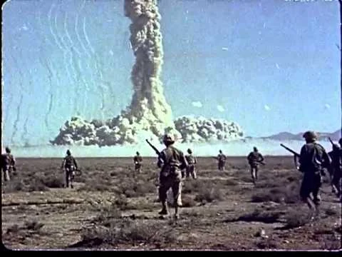 Marines march toward ground zero during a “Desert Rock” exercise.