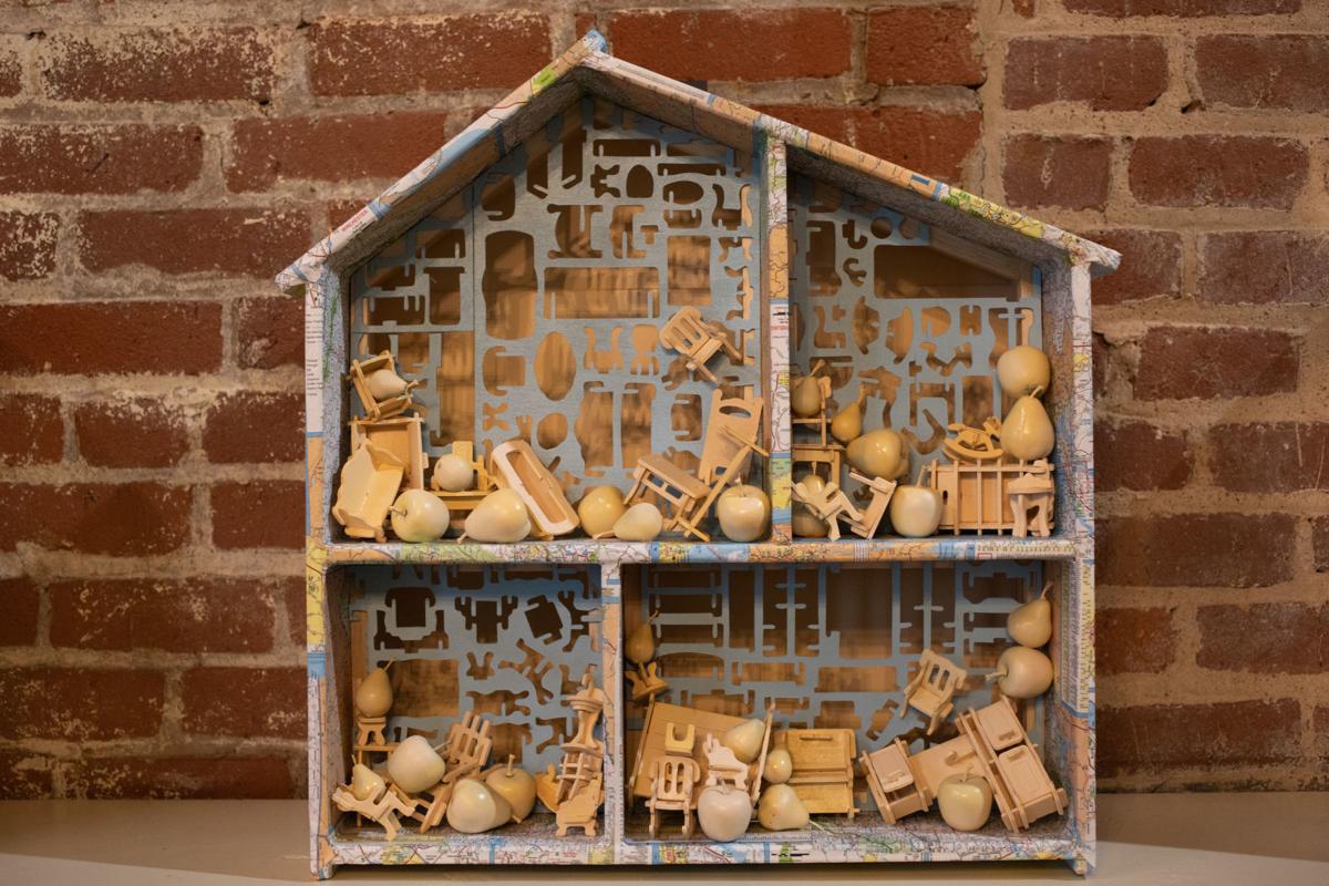 "Home is a State of Mind," by Pam Winegard, is among the pieces in the exhibition "No Place Like Home," which features 25 dollhouses to honor the 25th anniversary of Miriam's House. Emily Elconin/The News & Advance
