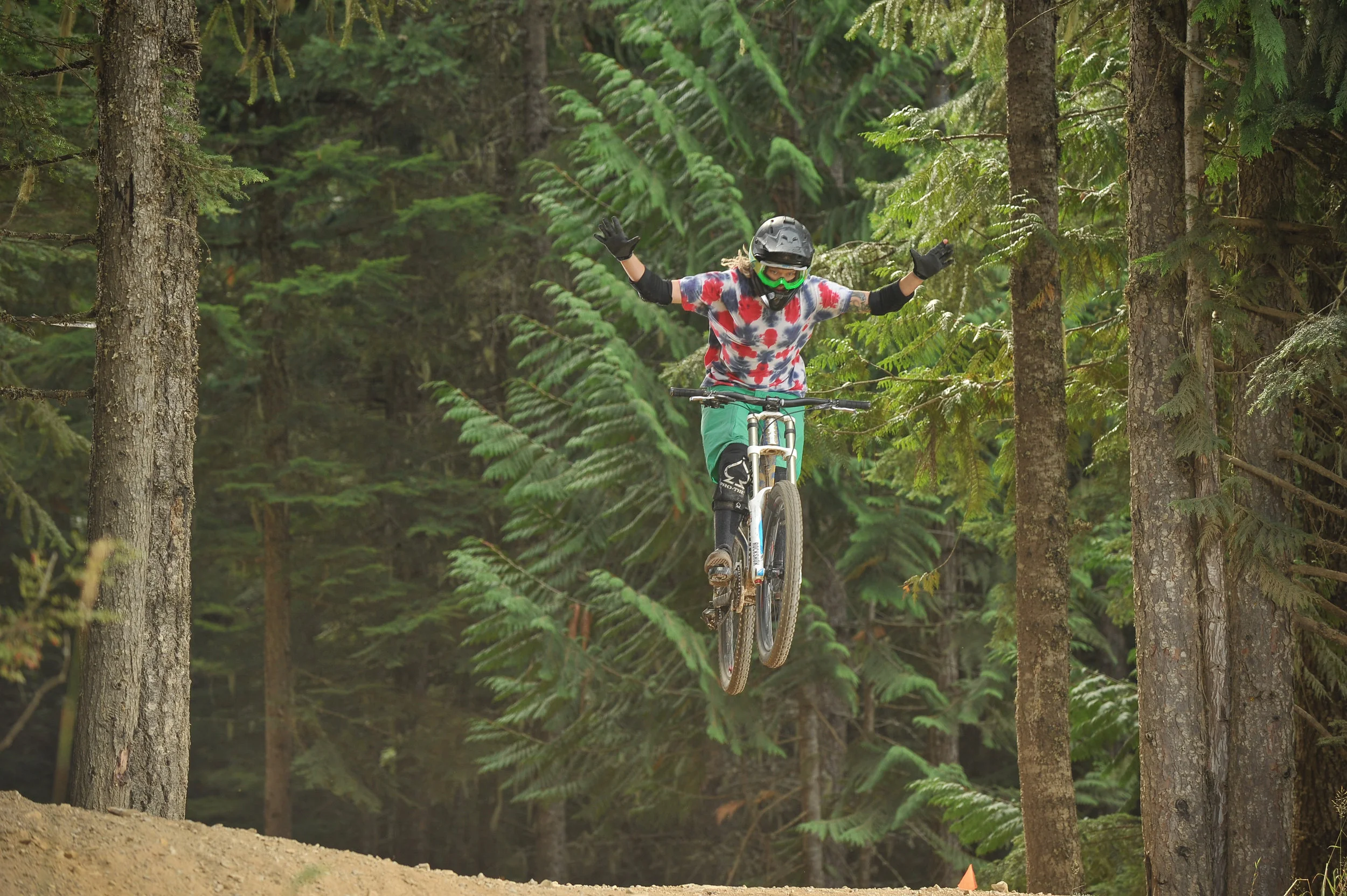 No-hander on A-line in the Whistler Bike Park. Photo credit: Coast Mountain Photography
