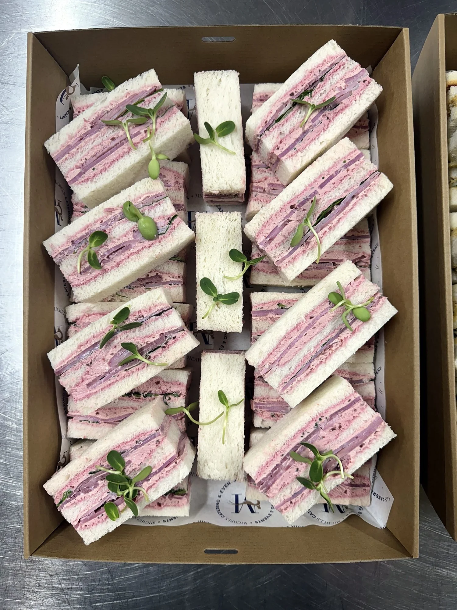 Boxed ribbon sandwiches ready for office delivery
