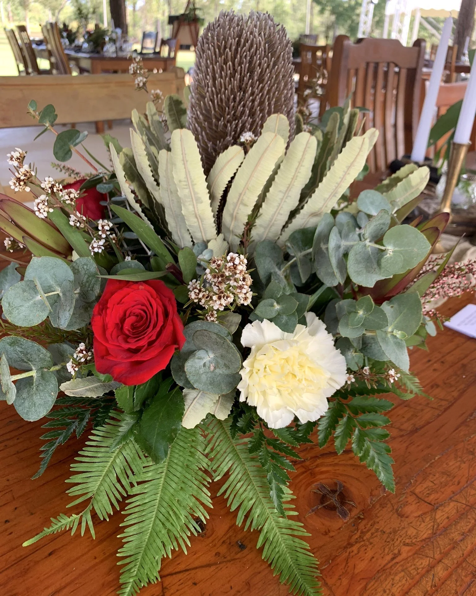 Native banksia and rose wedding centrepiece