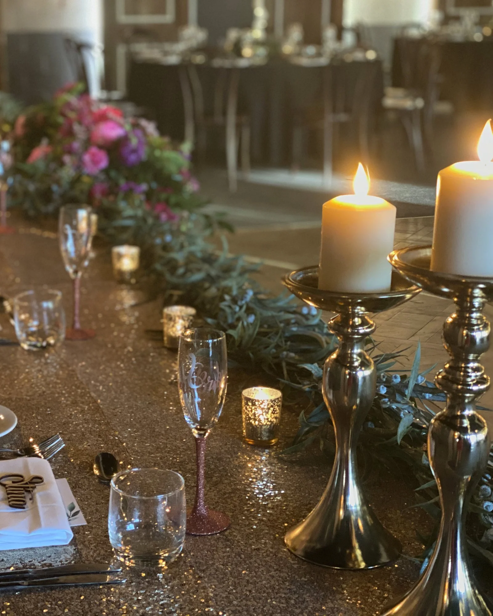 Candlelit wedding table with gold candelabras