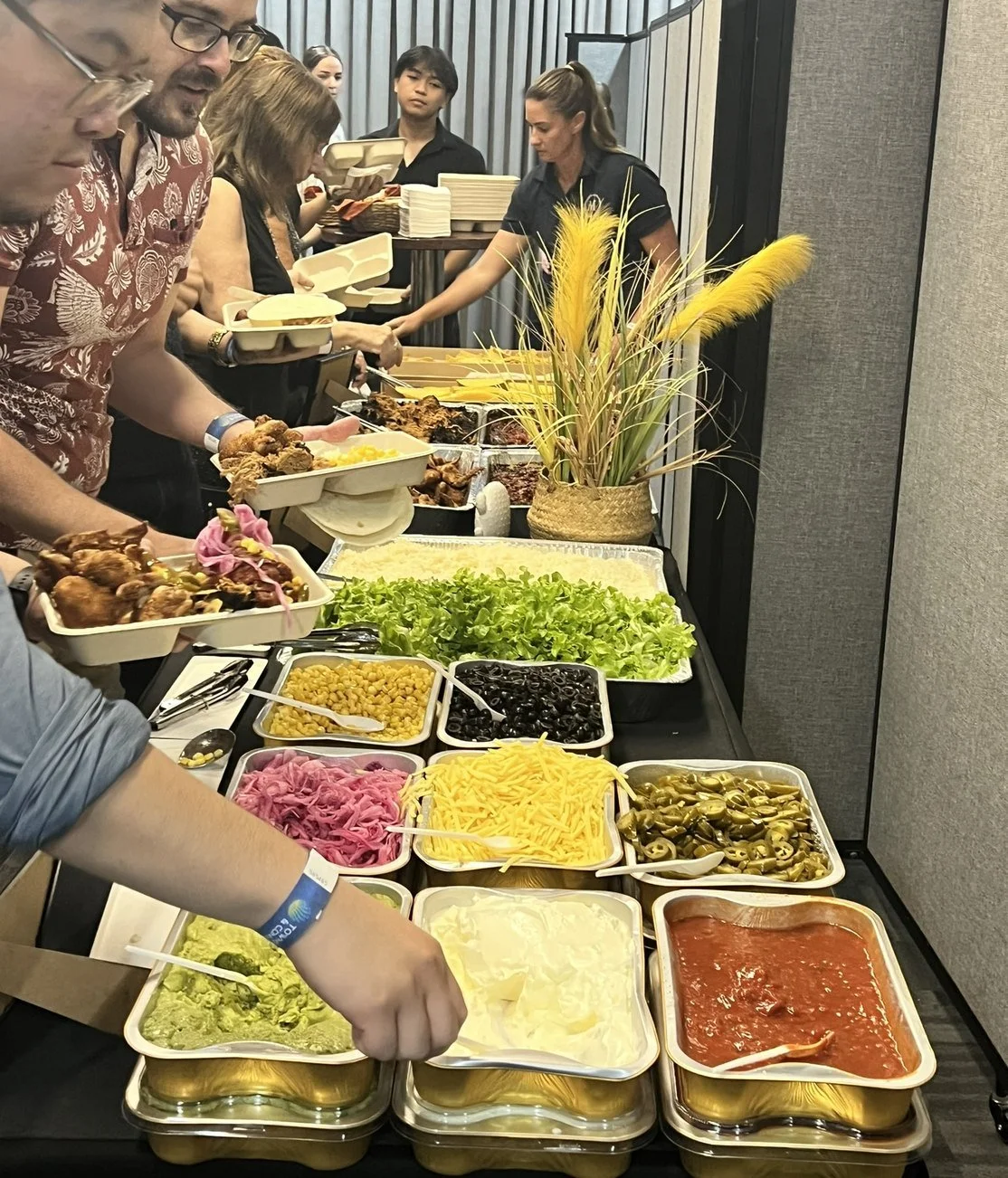 Guests serving themselves at a Michels taco station