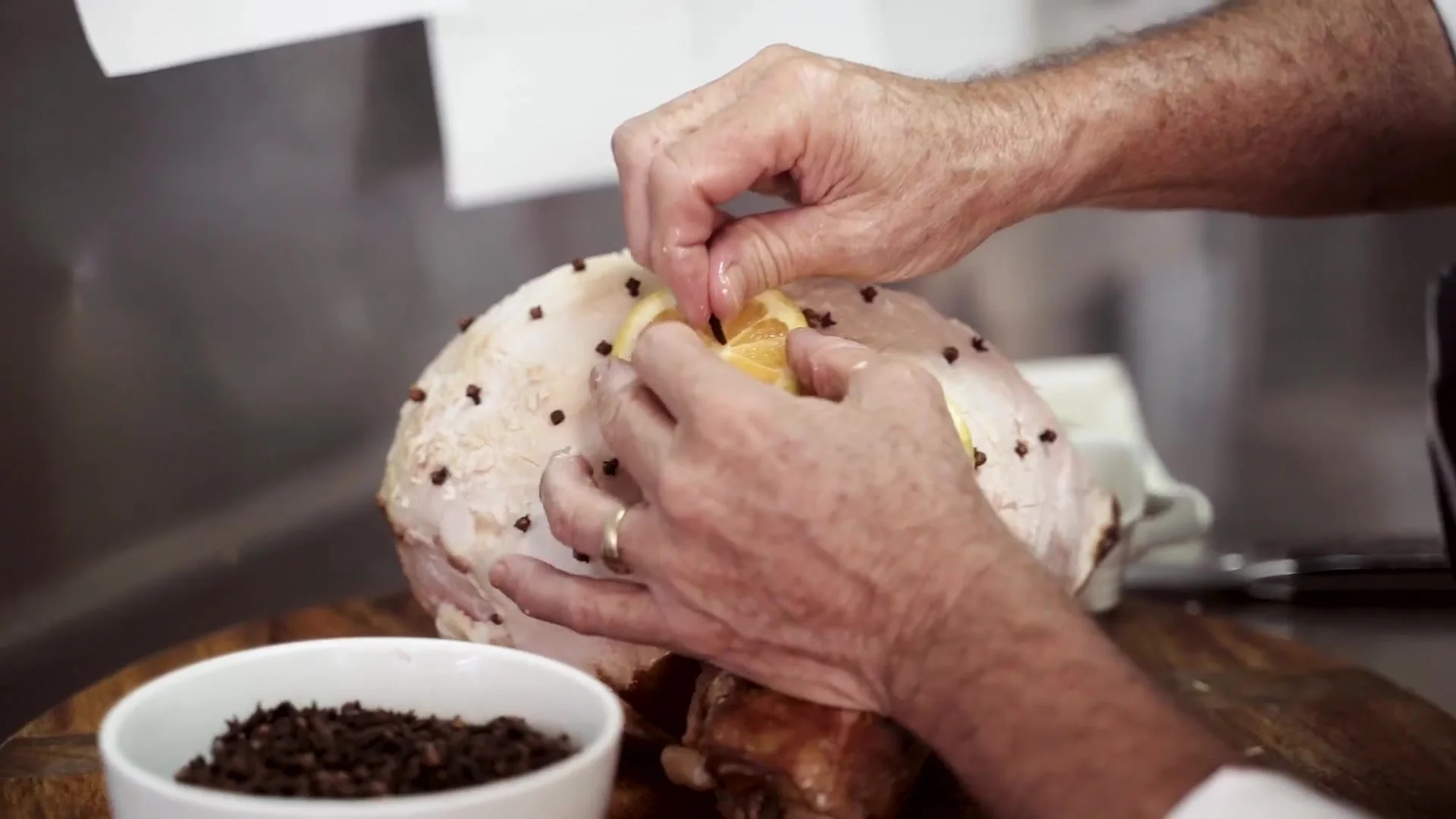 Chef studding a Christmas ham with cloves.jpg