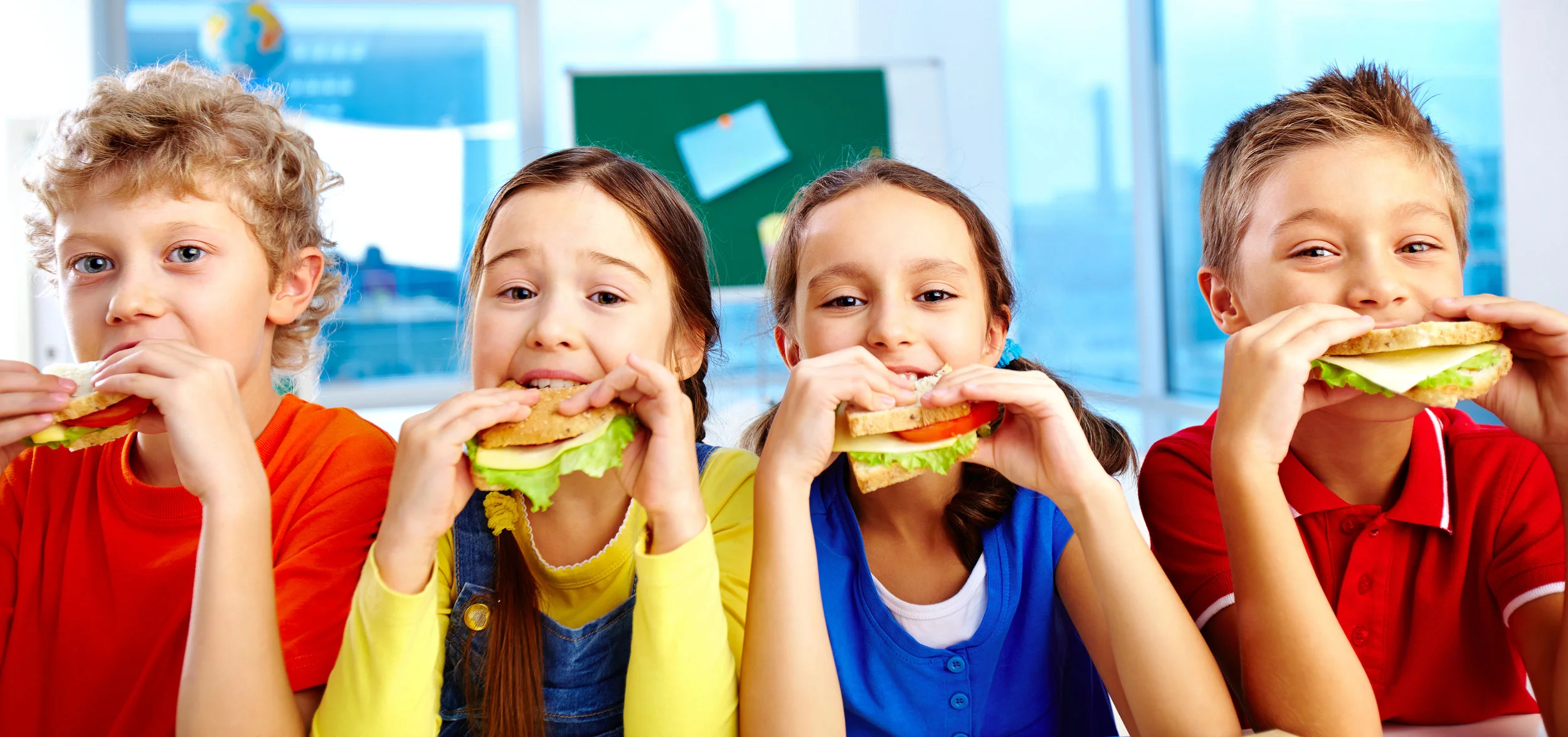 children eating sandwiches.jpeg