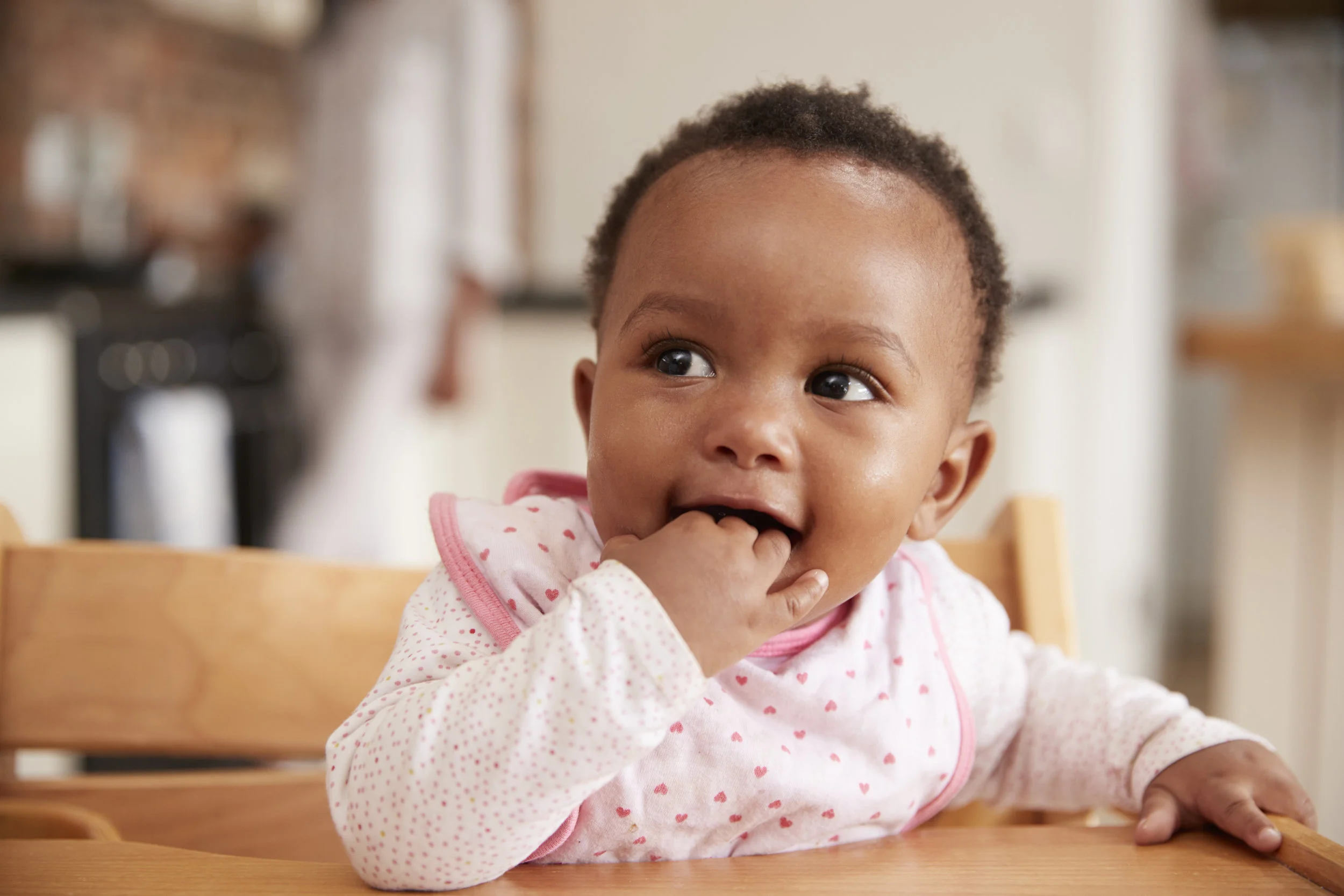 child in high chair ready to eat.jpeg