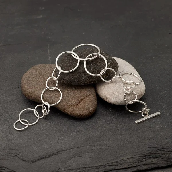 This is a sample of a Chain Bracelet, we can add personal charms and objects if available.